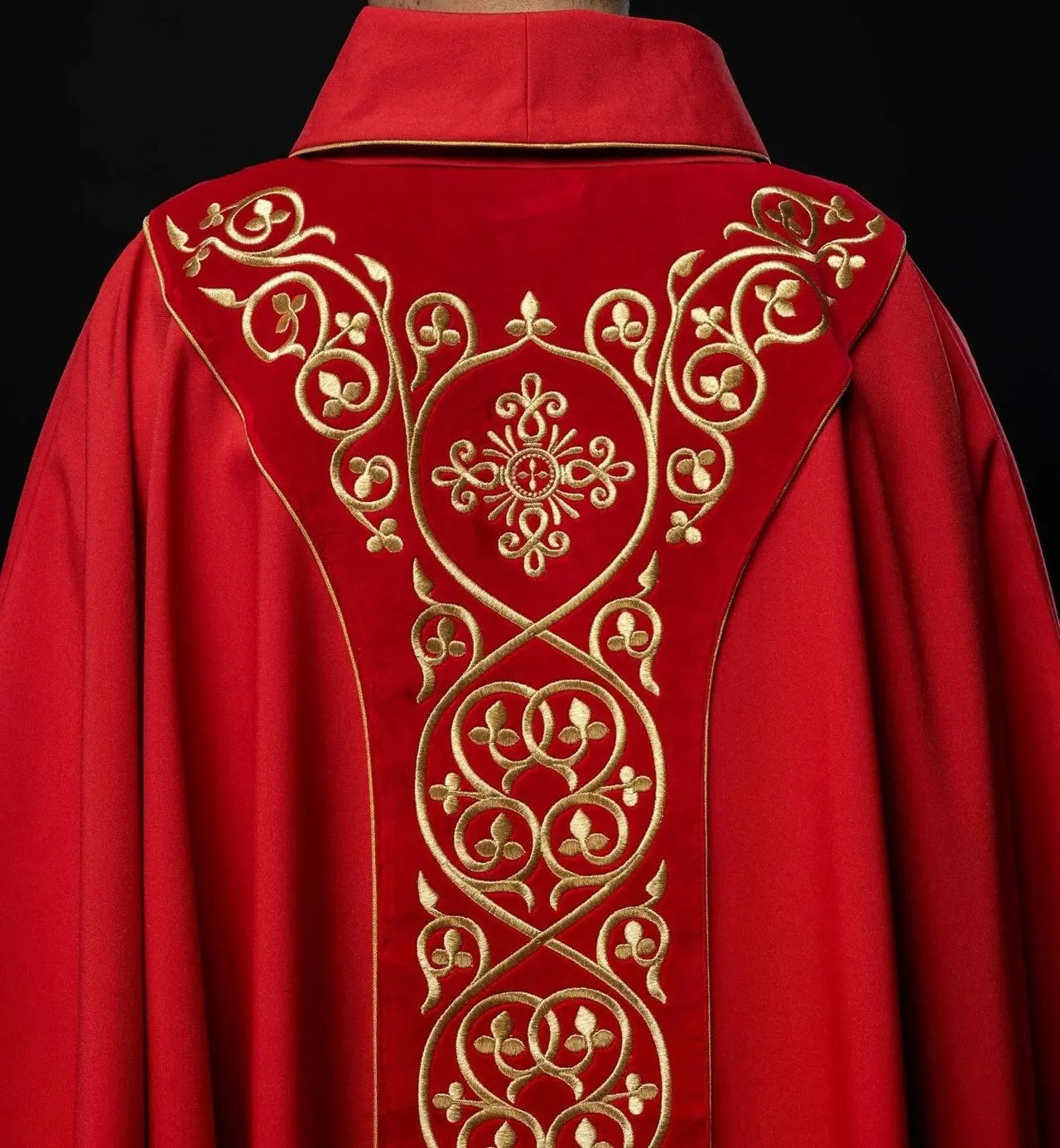 Red liturgical chasuble decorated with embroidery on velvet