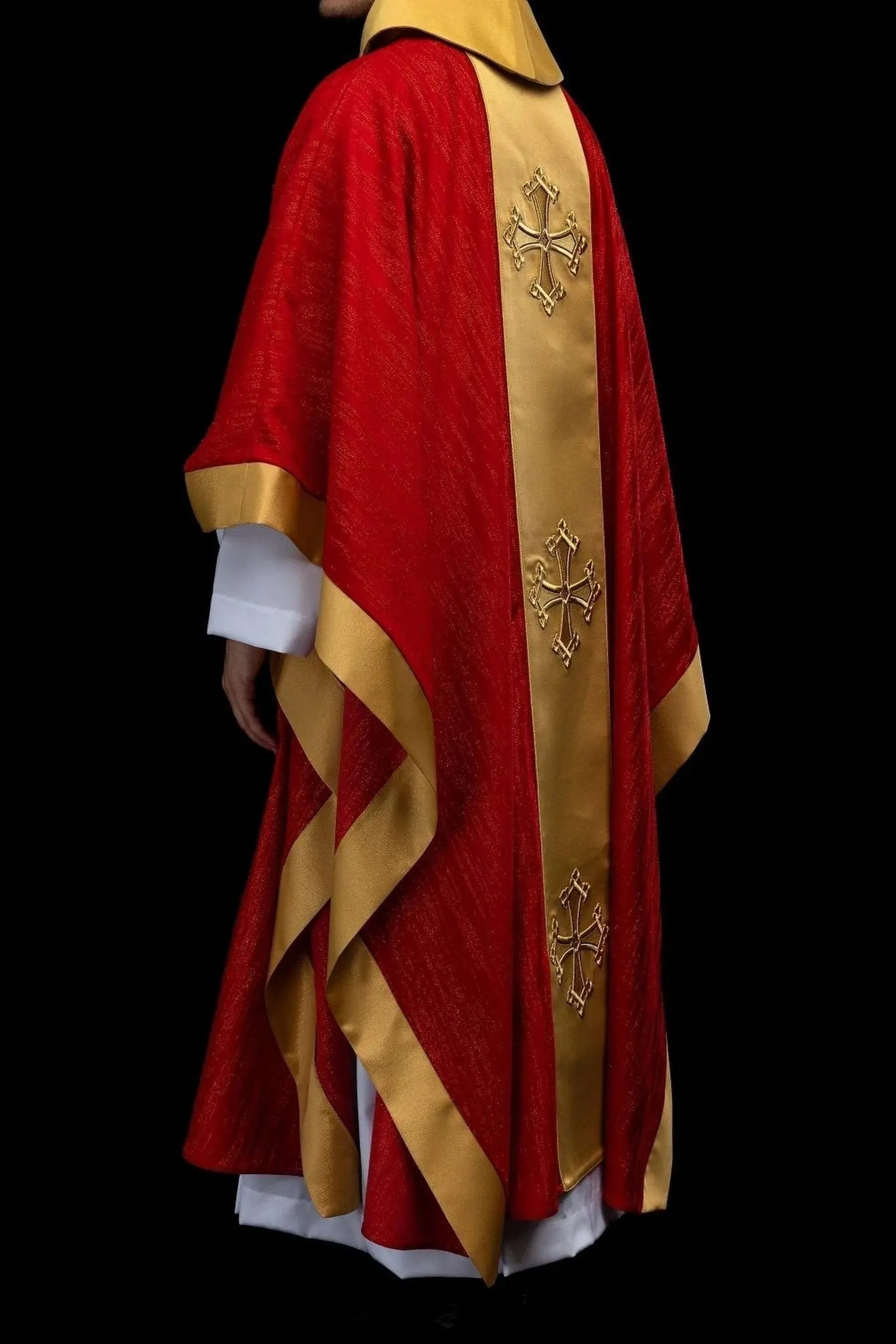 Red chasuble with embroidered cross motif and decorative gold band