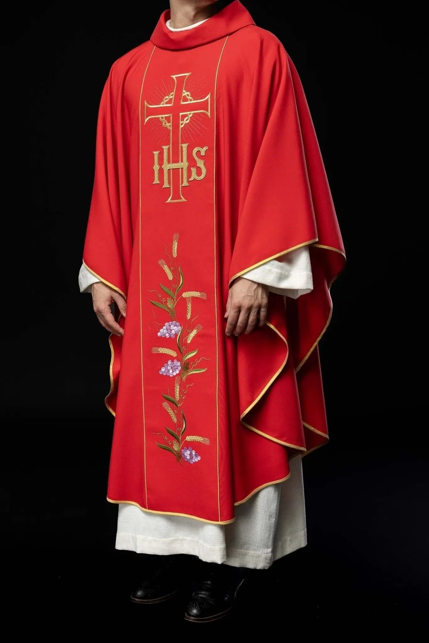 Red chasuble with decorated gold belt with IHS and ears