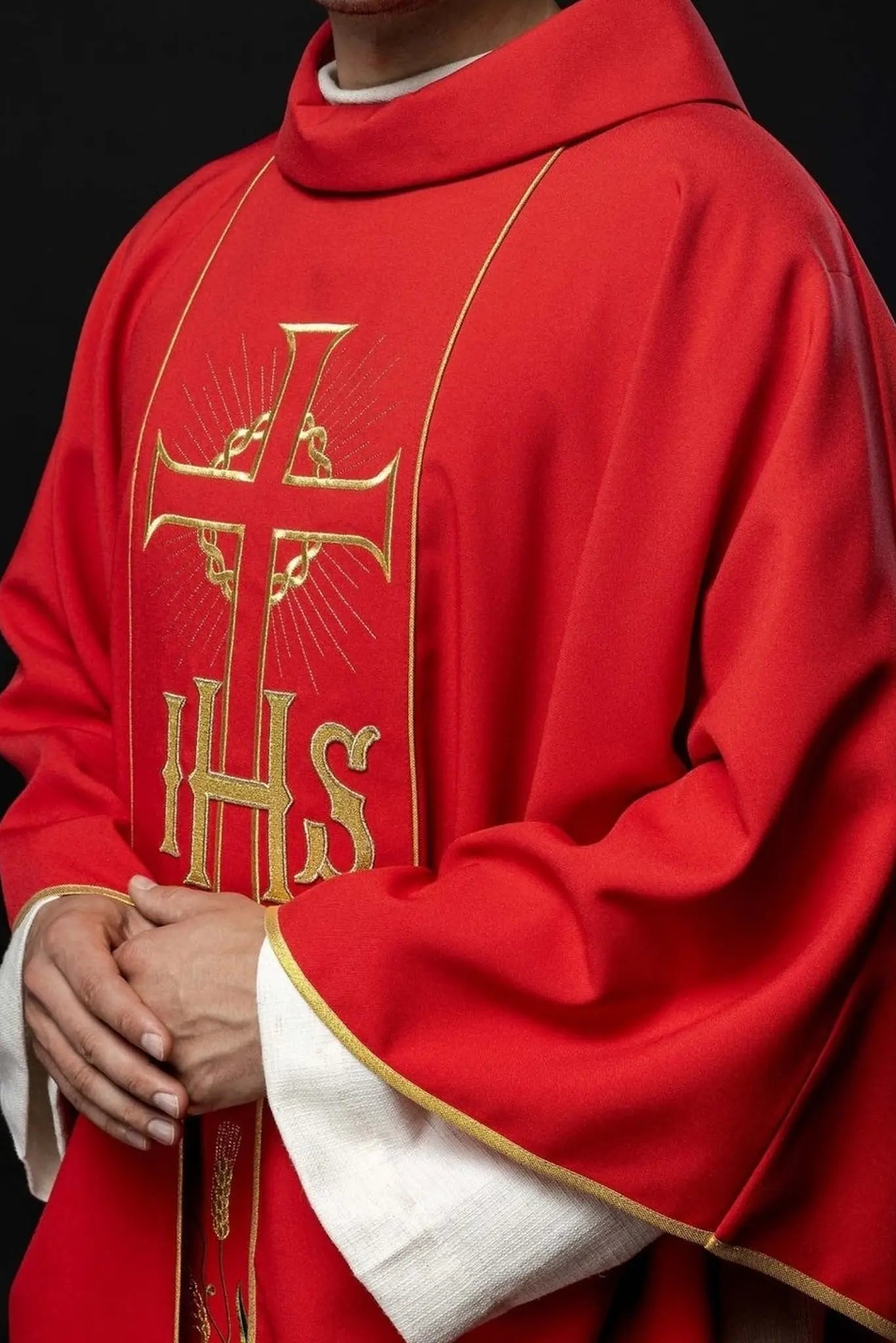 Red chasuble with decorated gold belt with IHS and ears