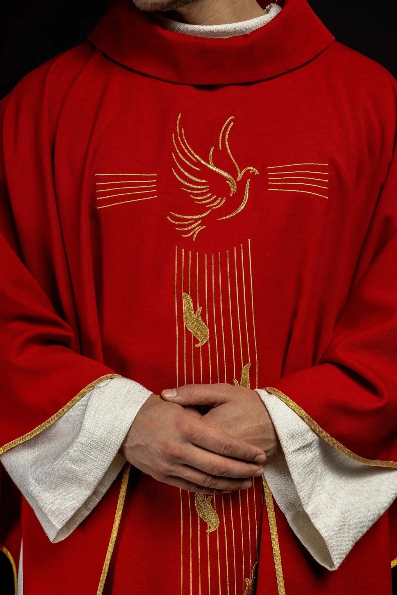 Red chasuble with gold trim and Holy Spirit embroidery