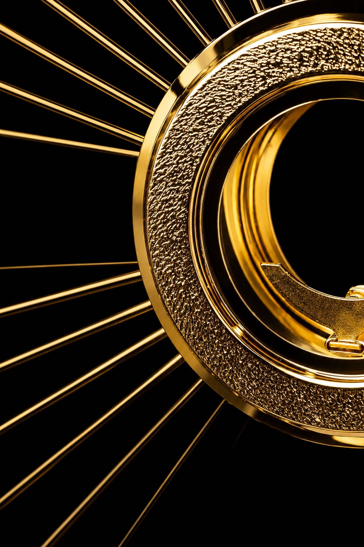 Gold-plated brass monstrance with cross and rays, side close-up