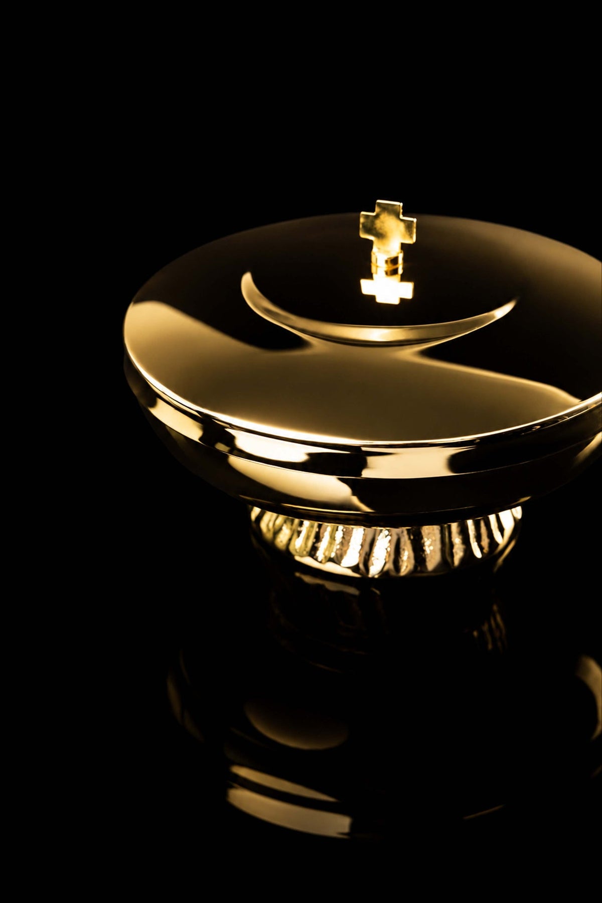 Gold-plated brass ciborium with a cross, angled view of lid