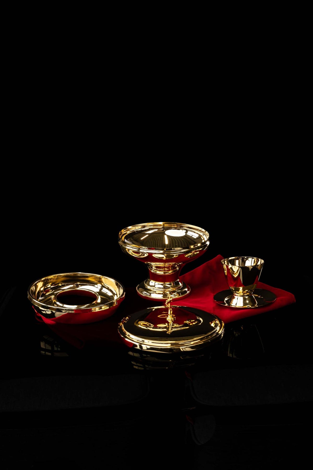 Gold-plated brass ciborium with beaded rim and pedestal base, close-up