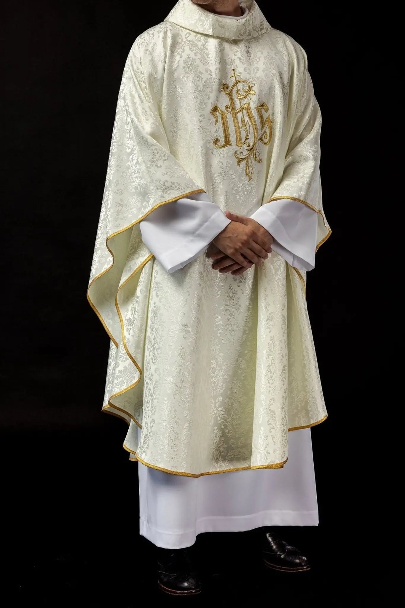 Ecru chasuble with embroidered IHS motif on decorative fabric