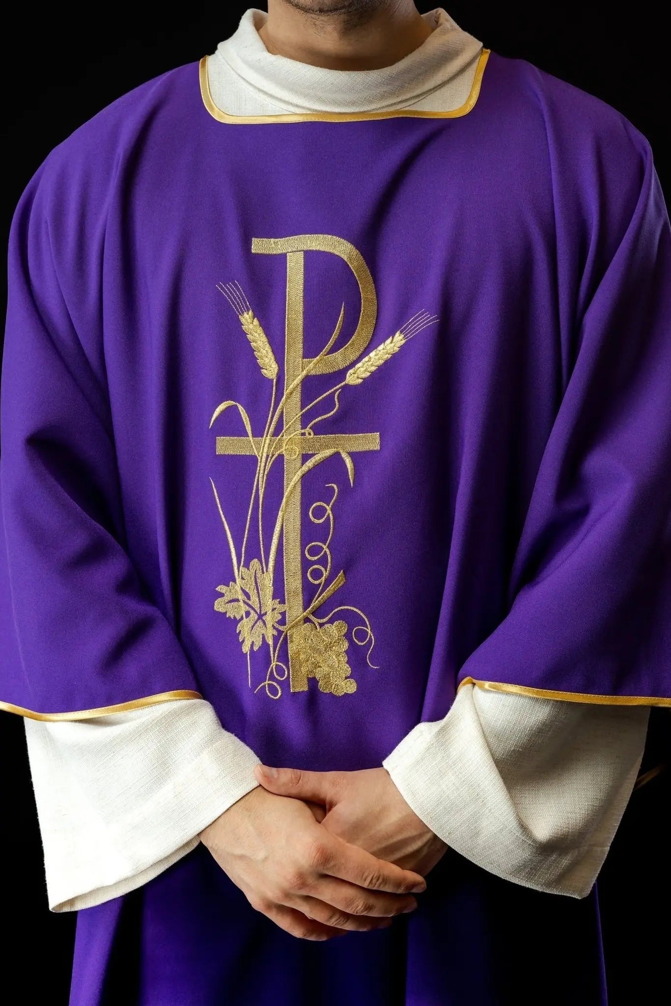 Purple dalmatica with gold Pax cross embroidery