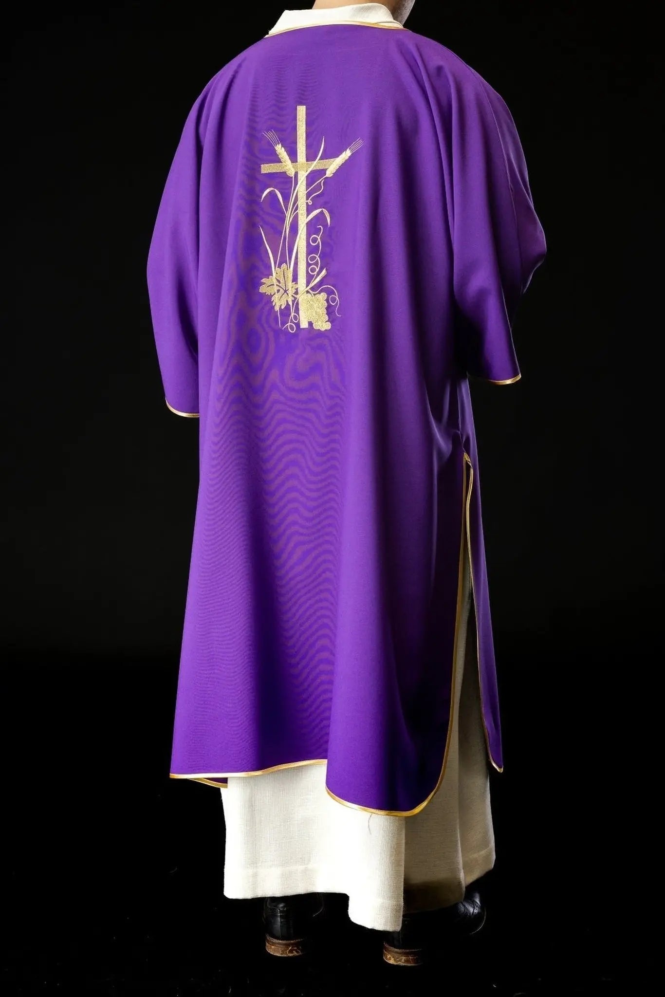 Purple dalmatica with gold Pax cross embroidery