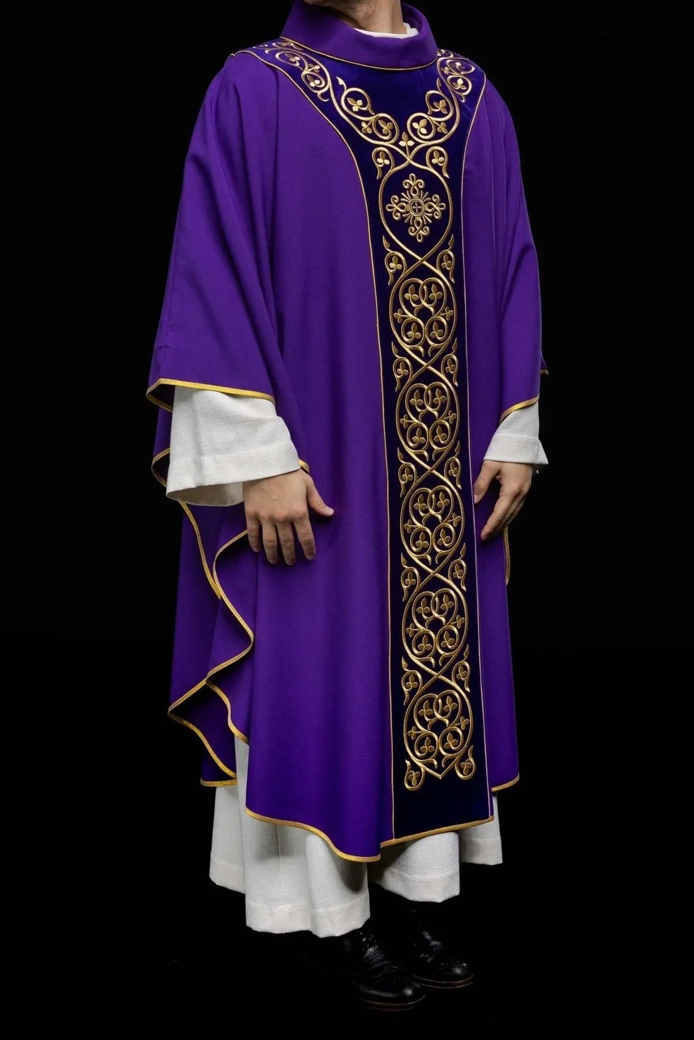 Purple liturgical chasuble decorated with embroidery on velvet