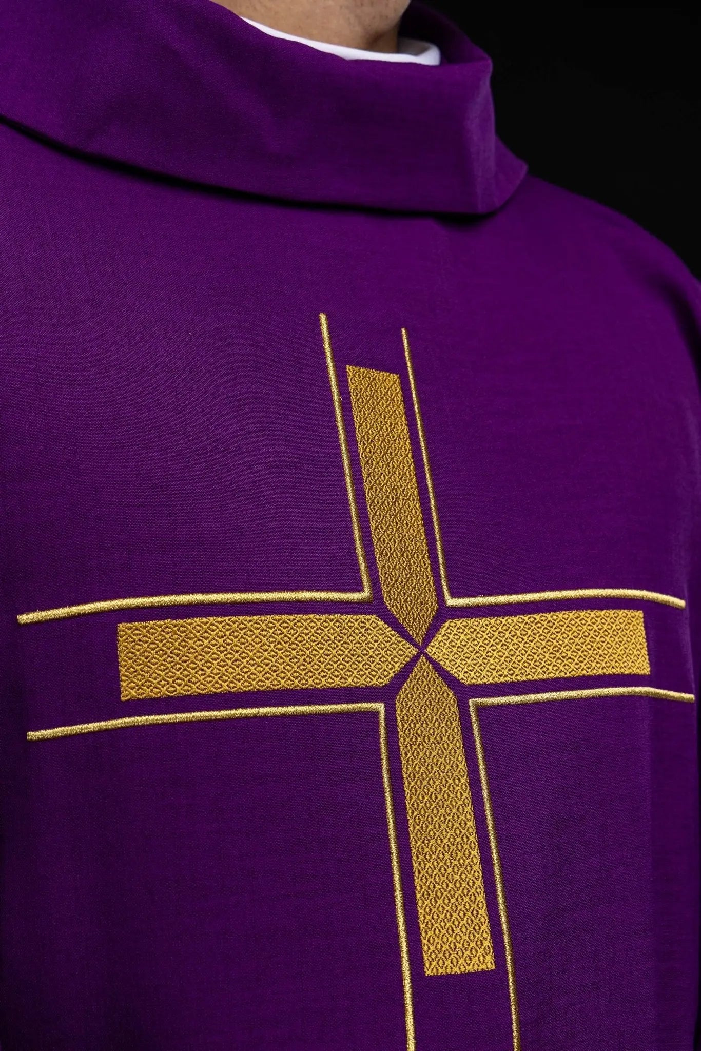 Purple chasuble with an embroidered cross motif