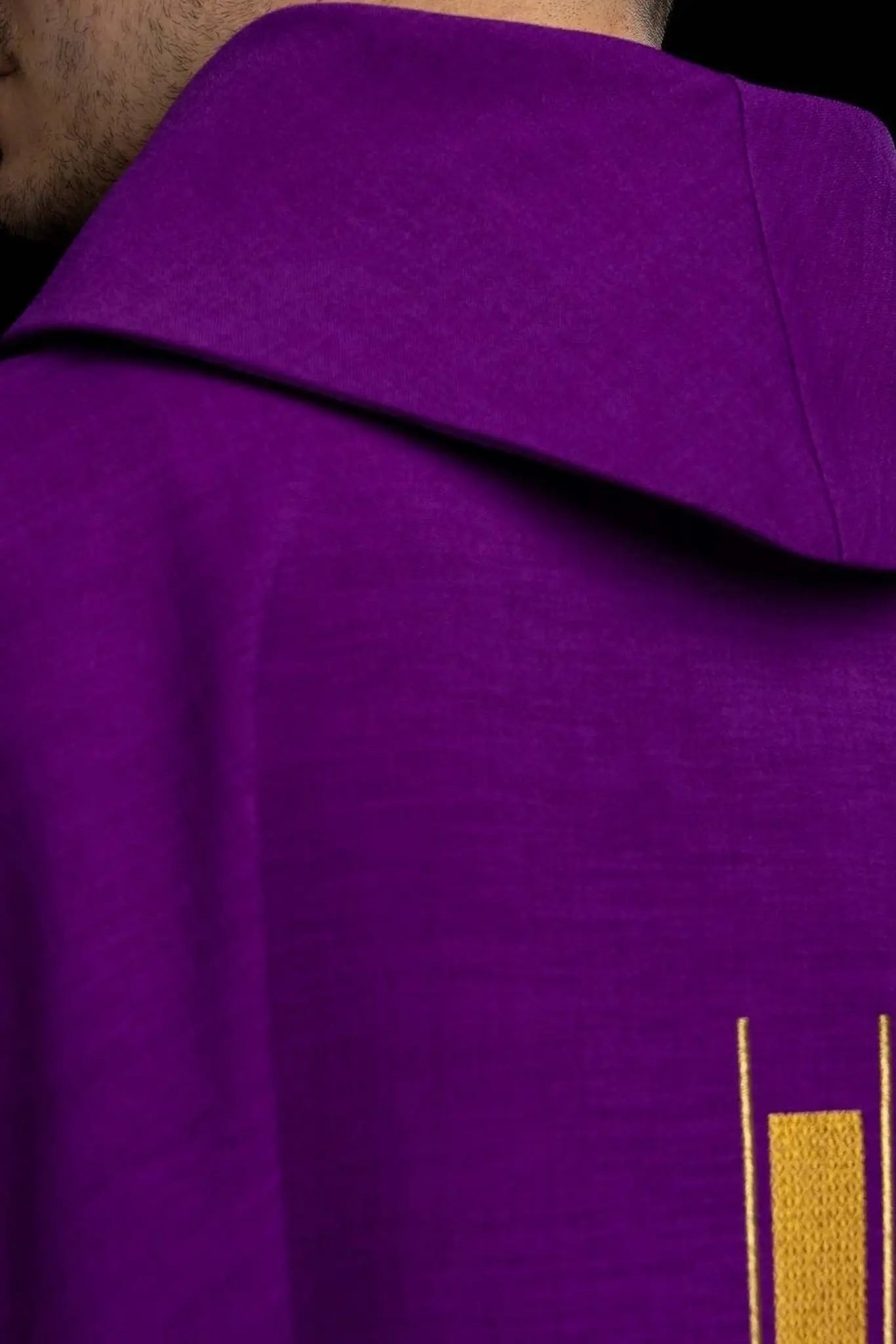 Purple chasuble with an embroidered cross motif