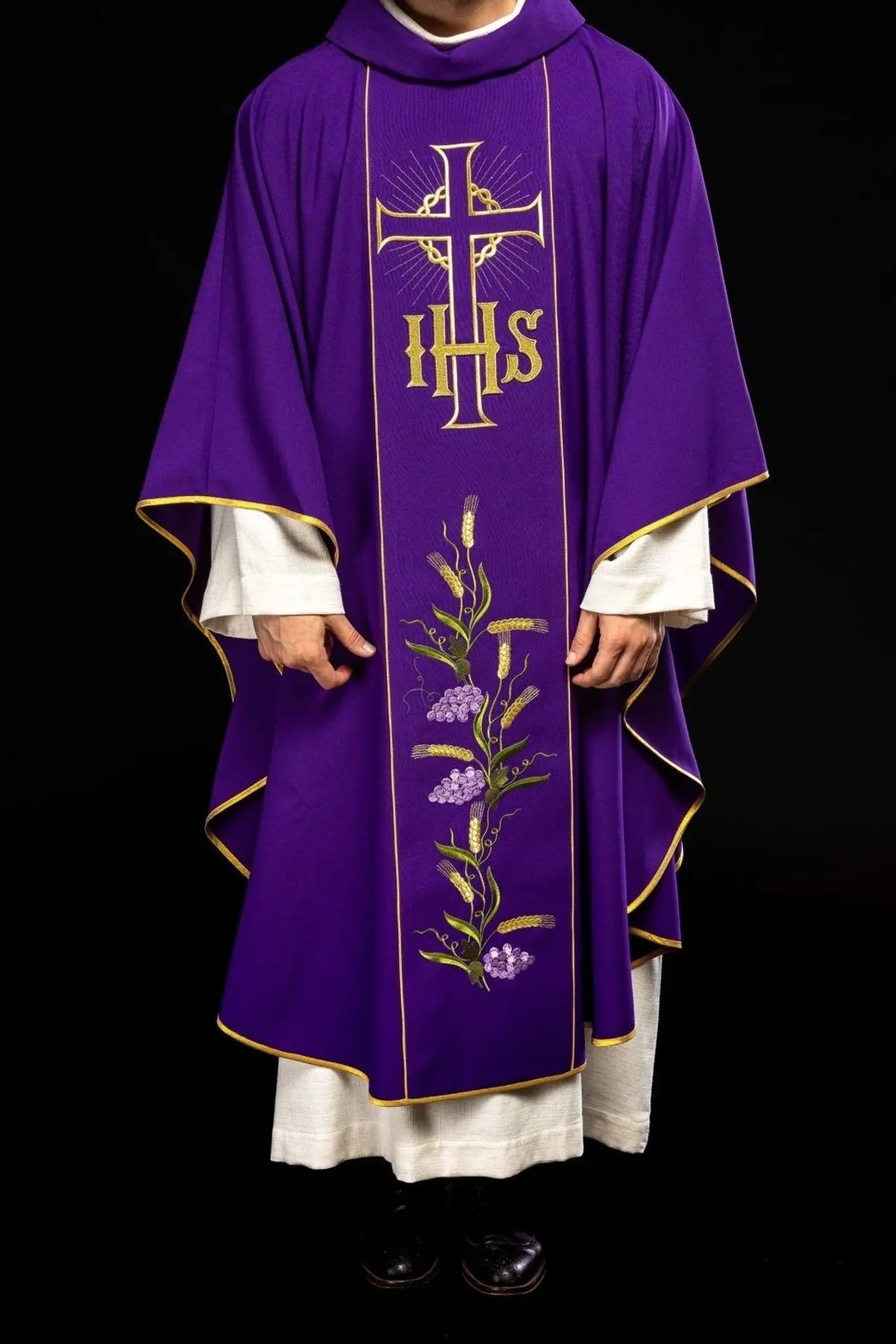 Purple chasuble with decorated gold belt with IHS and ears