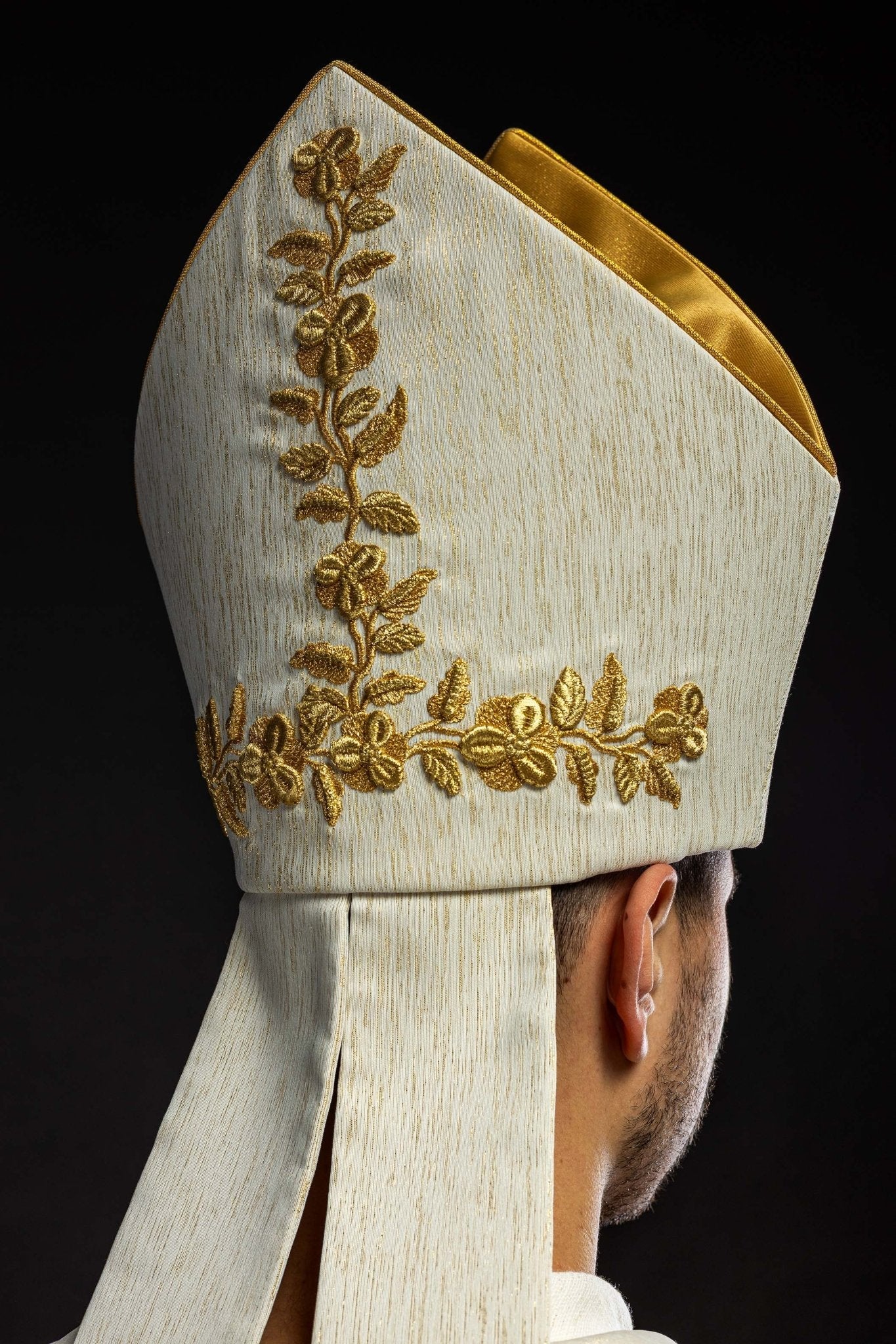 Ecru Marian mitre with rich gold embroidery and floral patterns