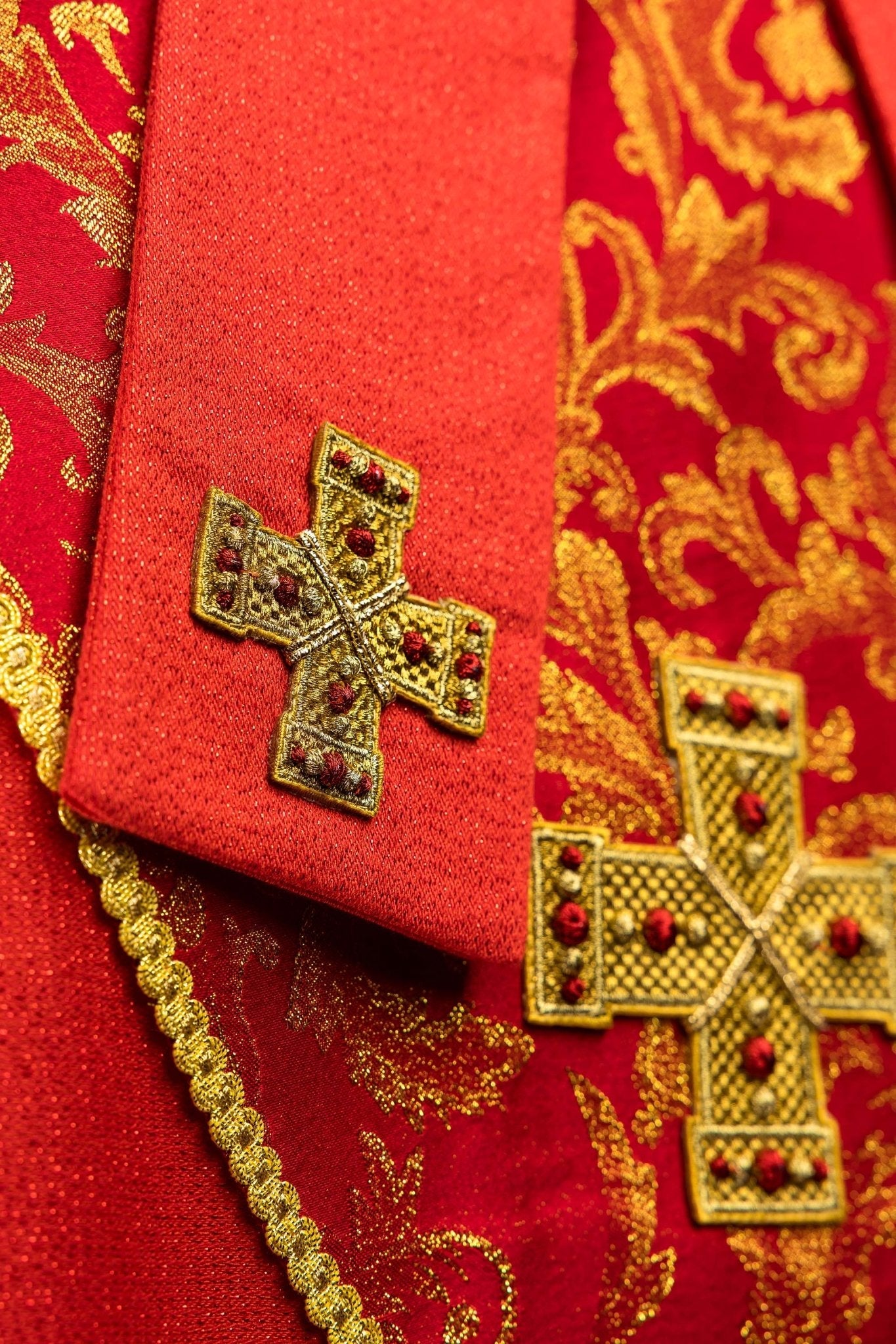 Red embroidered mitre with a cross motif and decorative jacquard fabric
