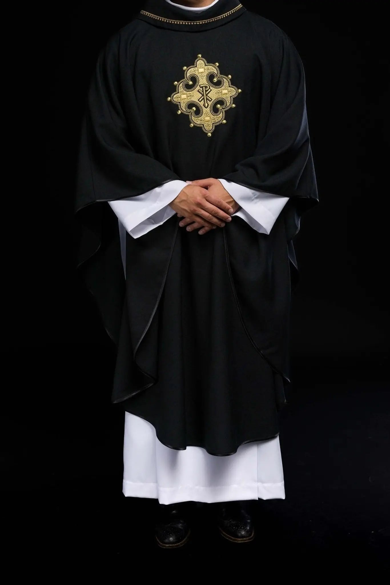Chasuble with embroidered cross and gold trim on collar in black