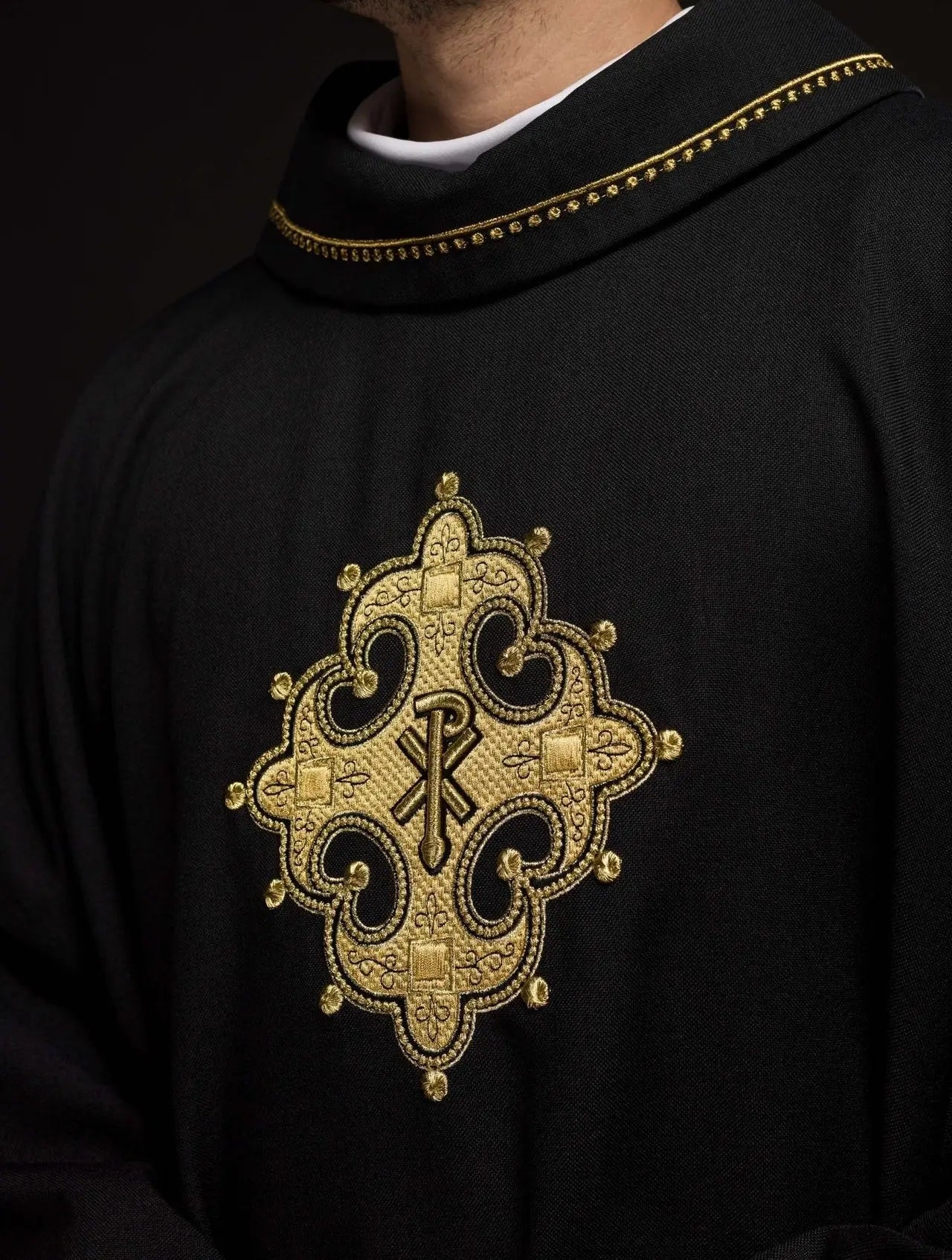 Chasuble with embroidered cross and gold trim on collar in black