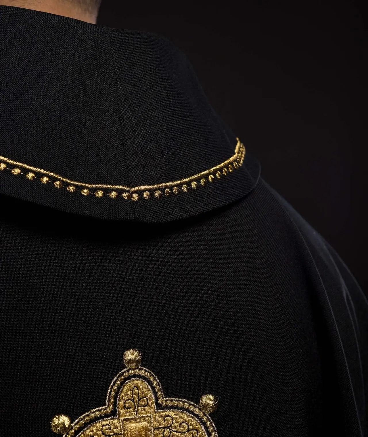 Chasuble with embroidered cross and gold trim on collar in black