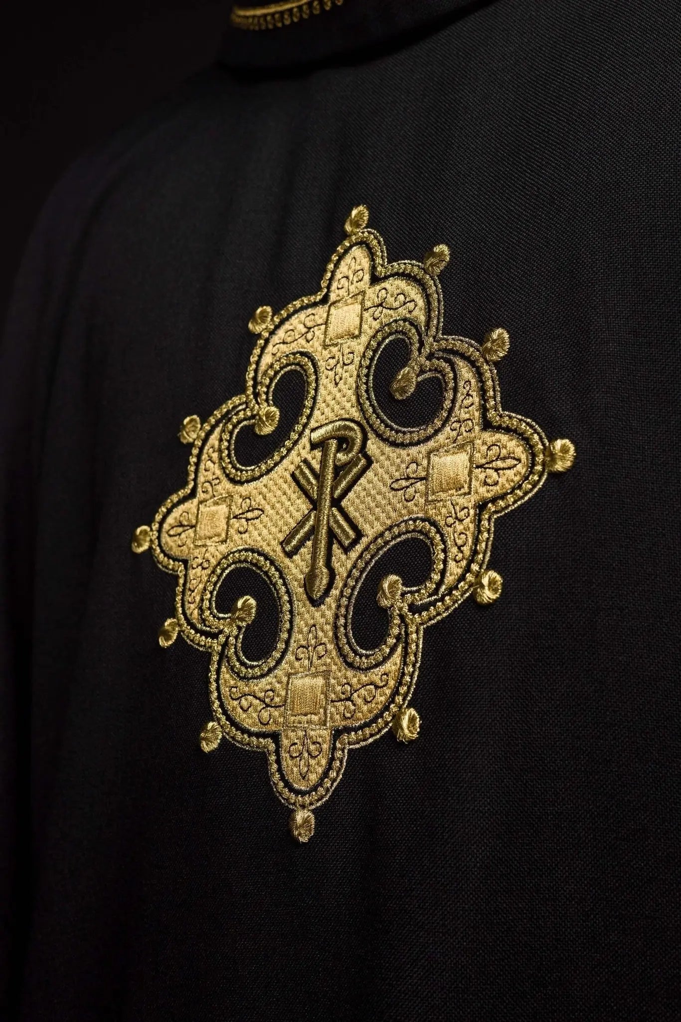 Chasuble with embroidered cross and gold trim on collar in black