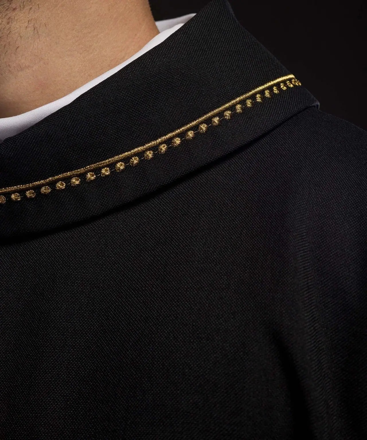 Chasuble with embroidered cross and gold trim on collar in black