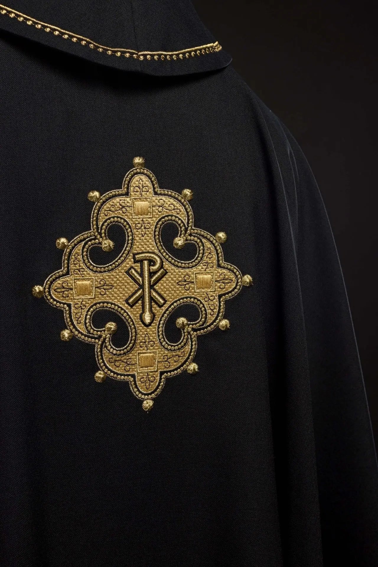 Chasuble with embroidered cross and gold trim on collar in black