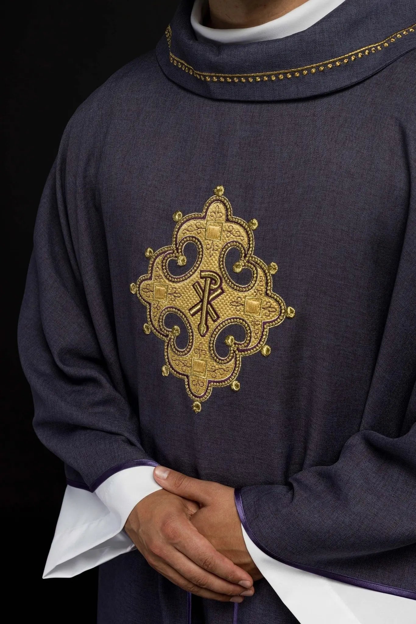 Chasuble with embroidered cross and gold trim on the collar in purple