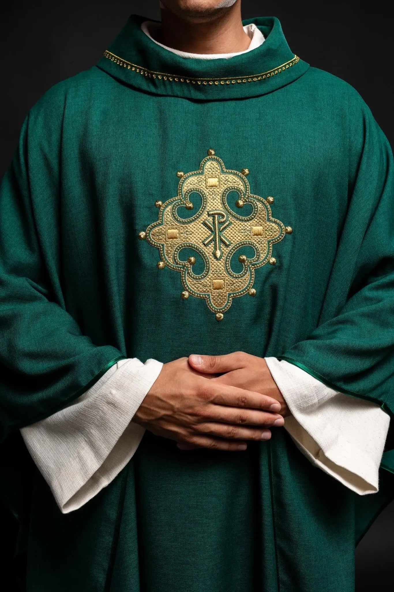 Chasuble with embroidered cross and gold trim on collar in green