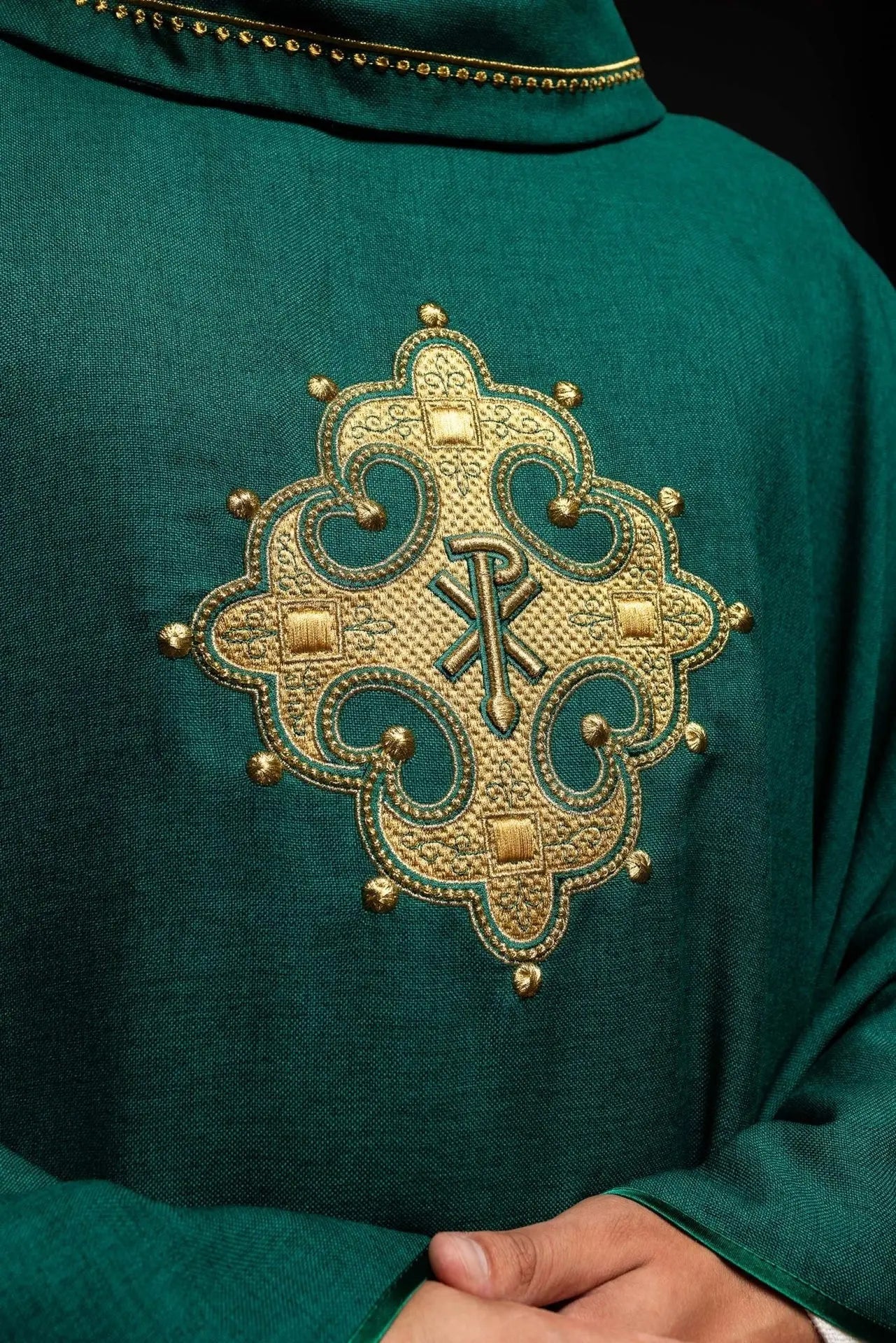 Chasuble with embroidered cross and gold trim on collar in green