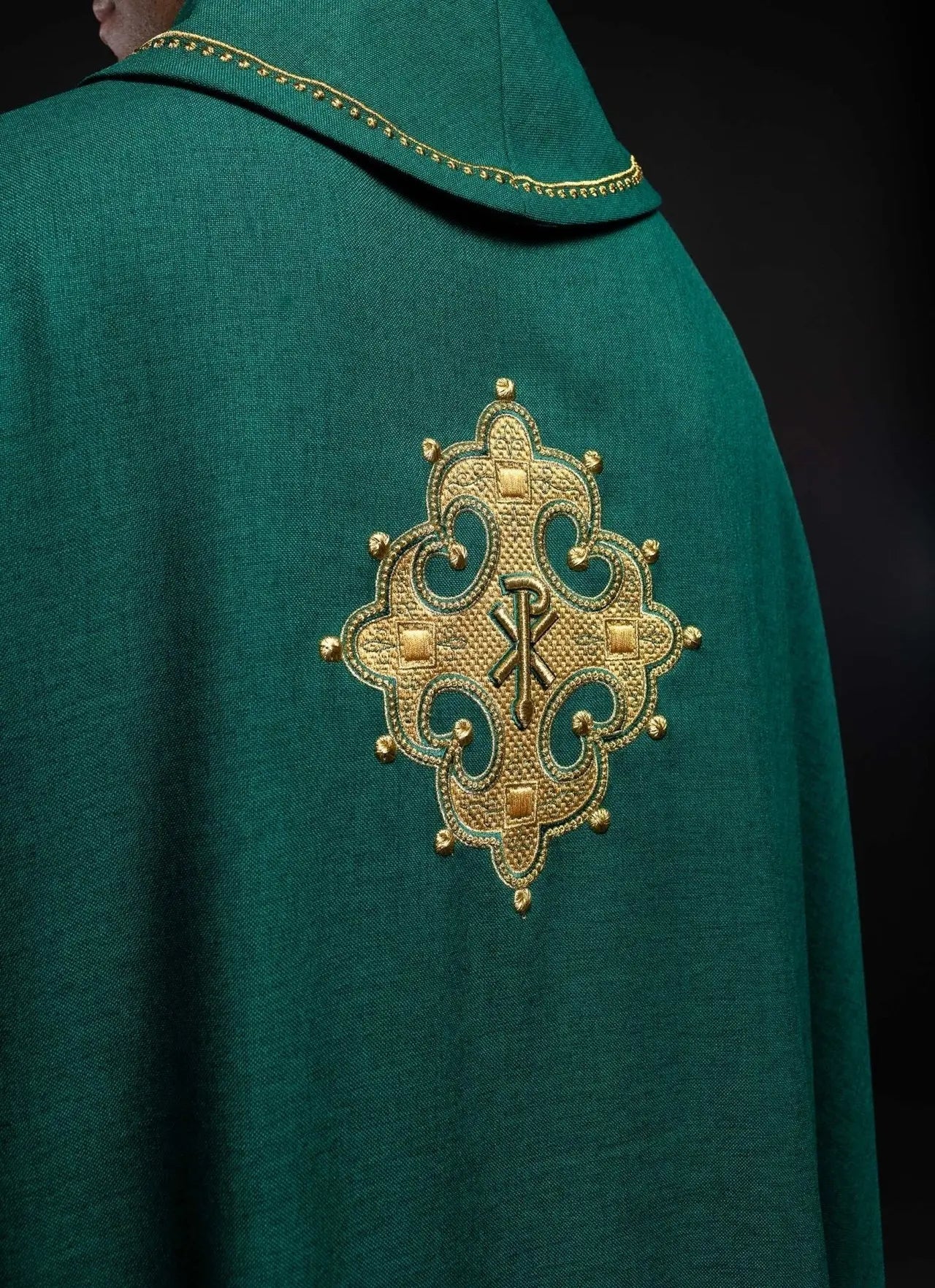 Chasuble with embroidered cross and gold trim on collar in green