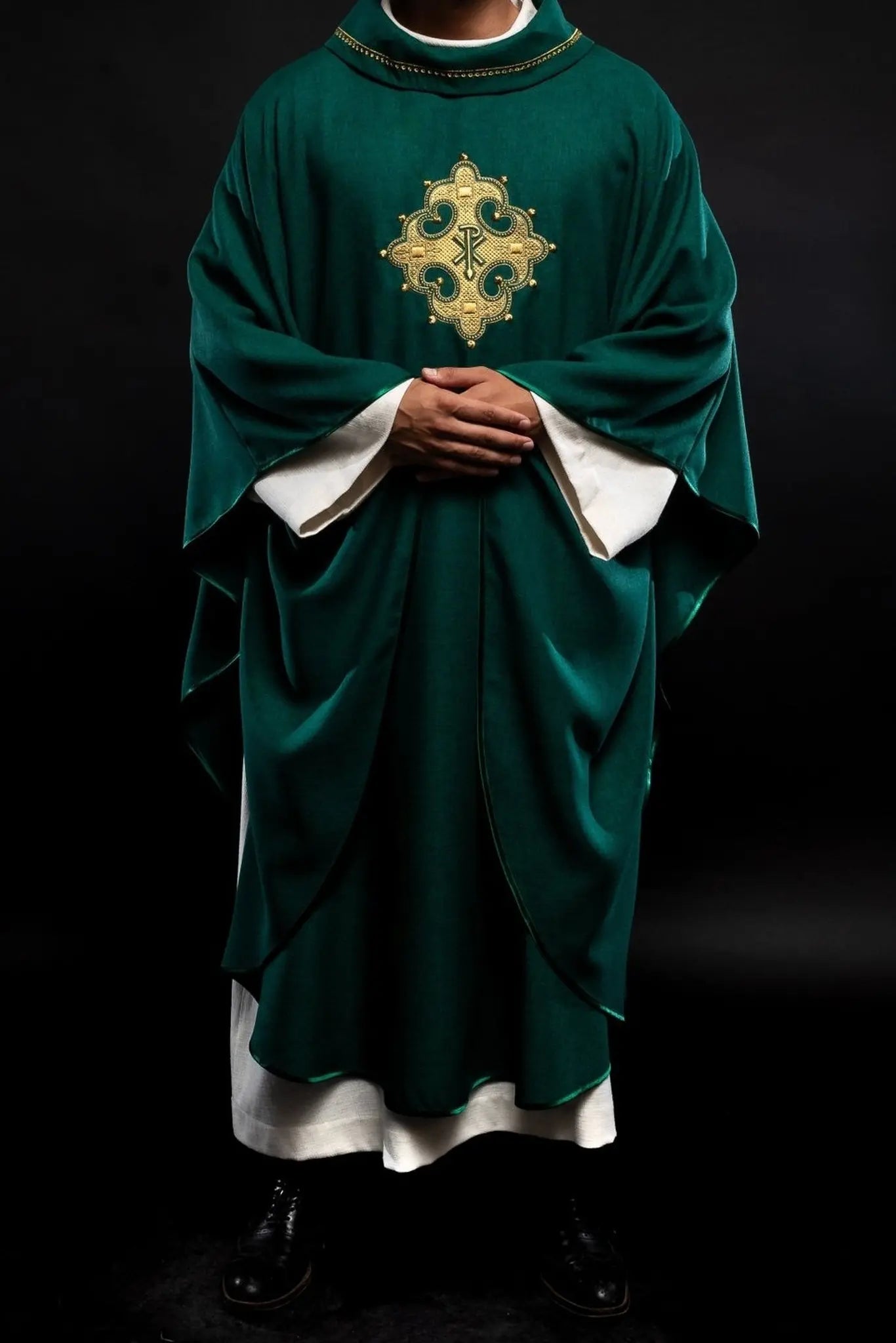Chasuble with embroidered cross and gold trim on collar in green