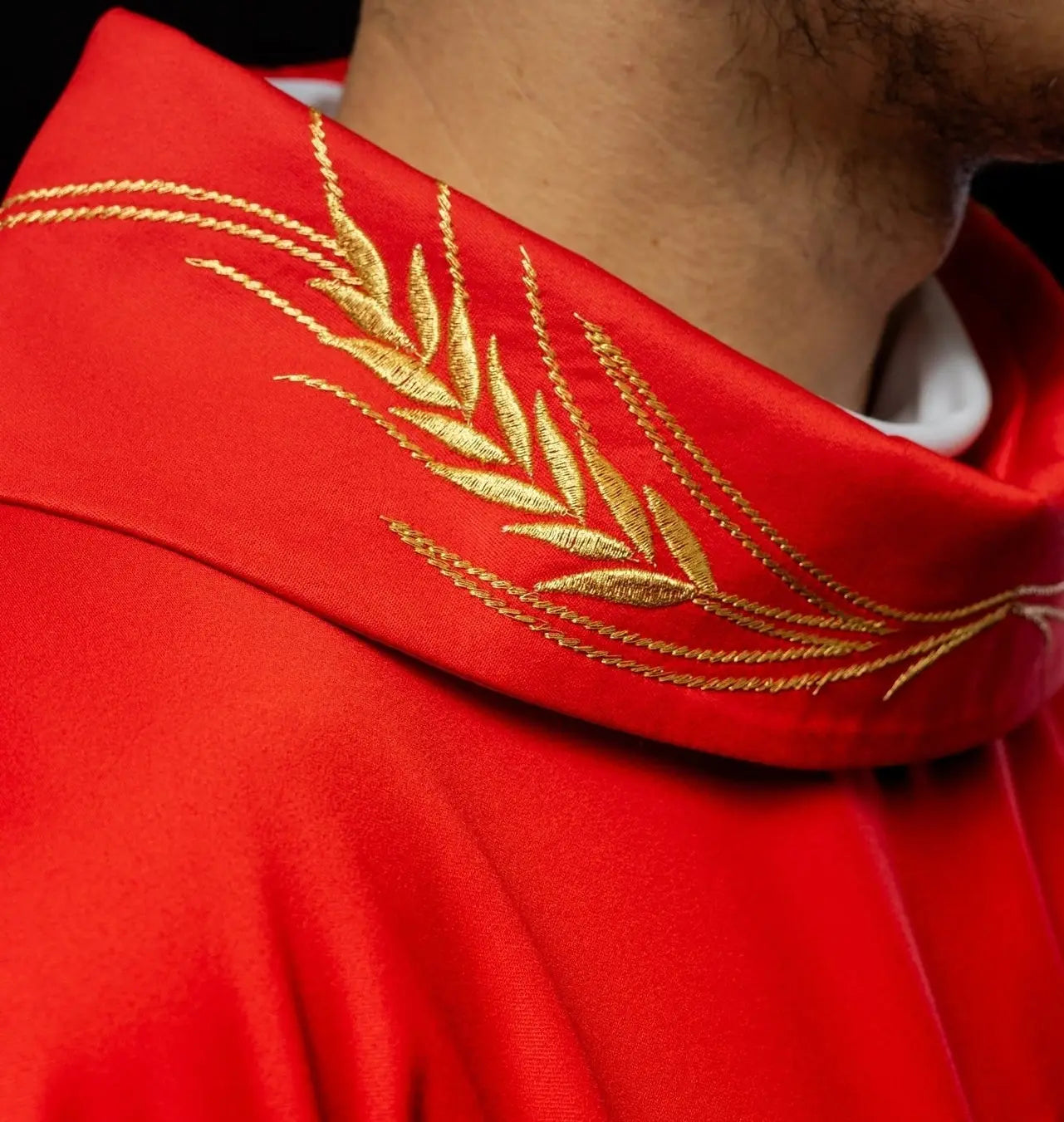 Chasuble with embroidered cross and red ear motifs