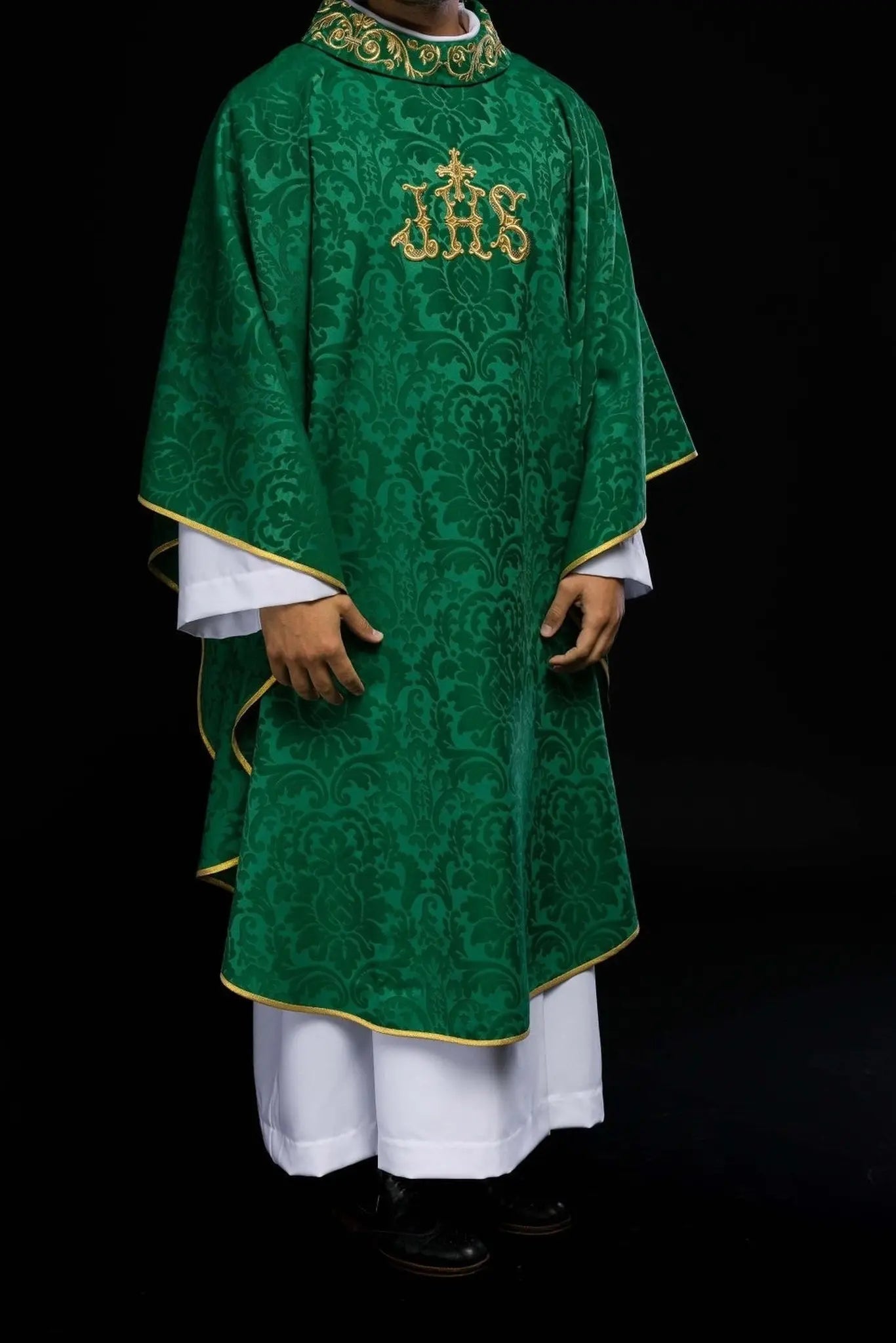 Green chasuble with IHS motif and richly embroidered collar on decorative fabric