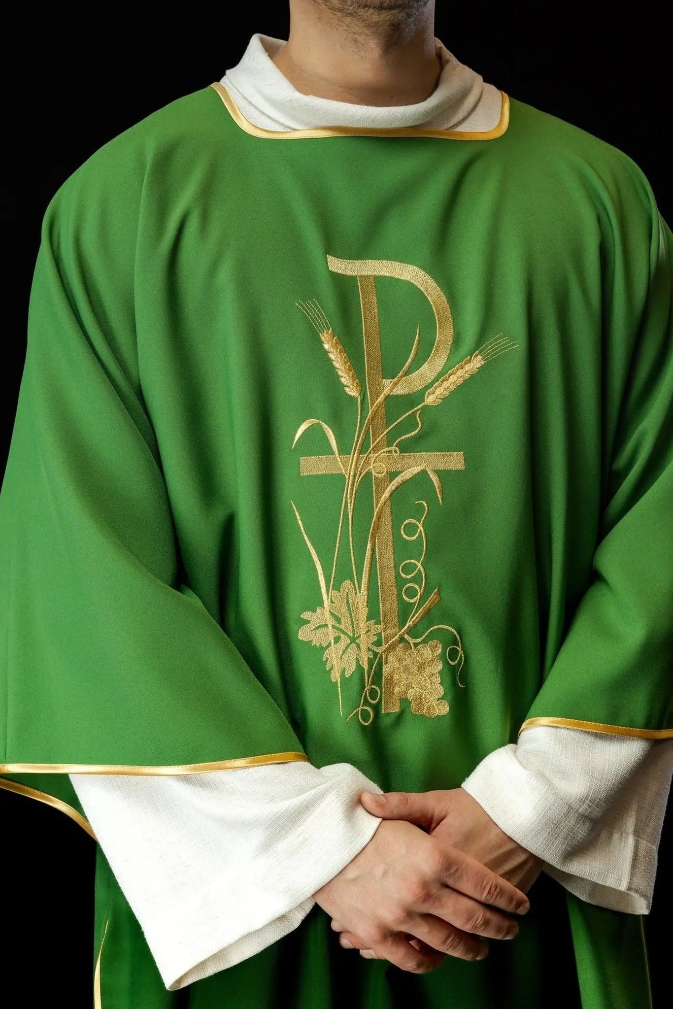 Green dalmatics with gold Pax cross embroidery