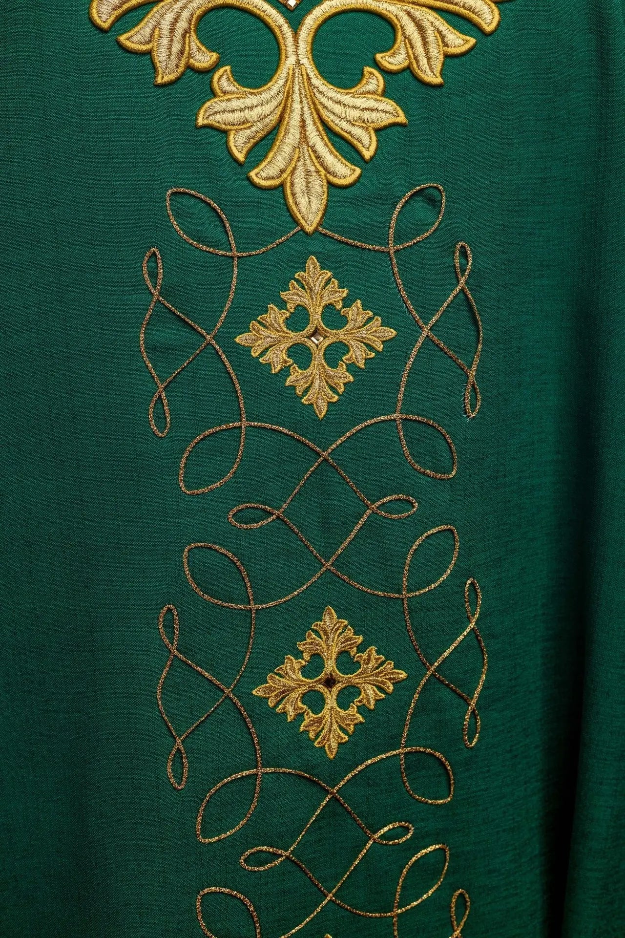 Green chasuble richly embroidered with string and stones