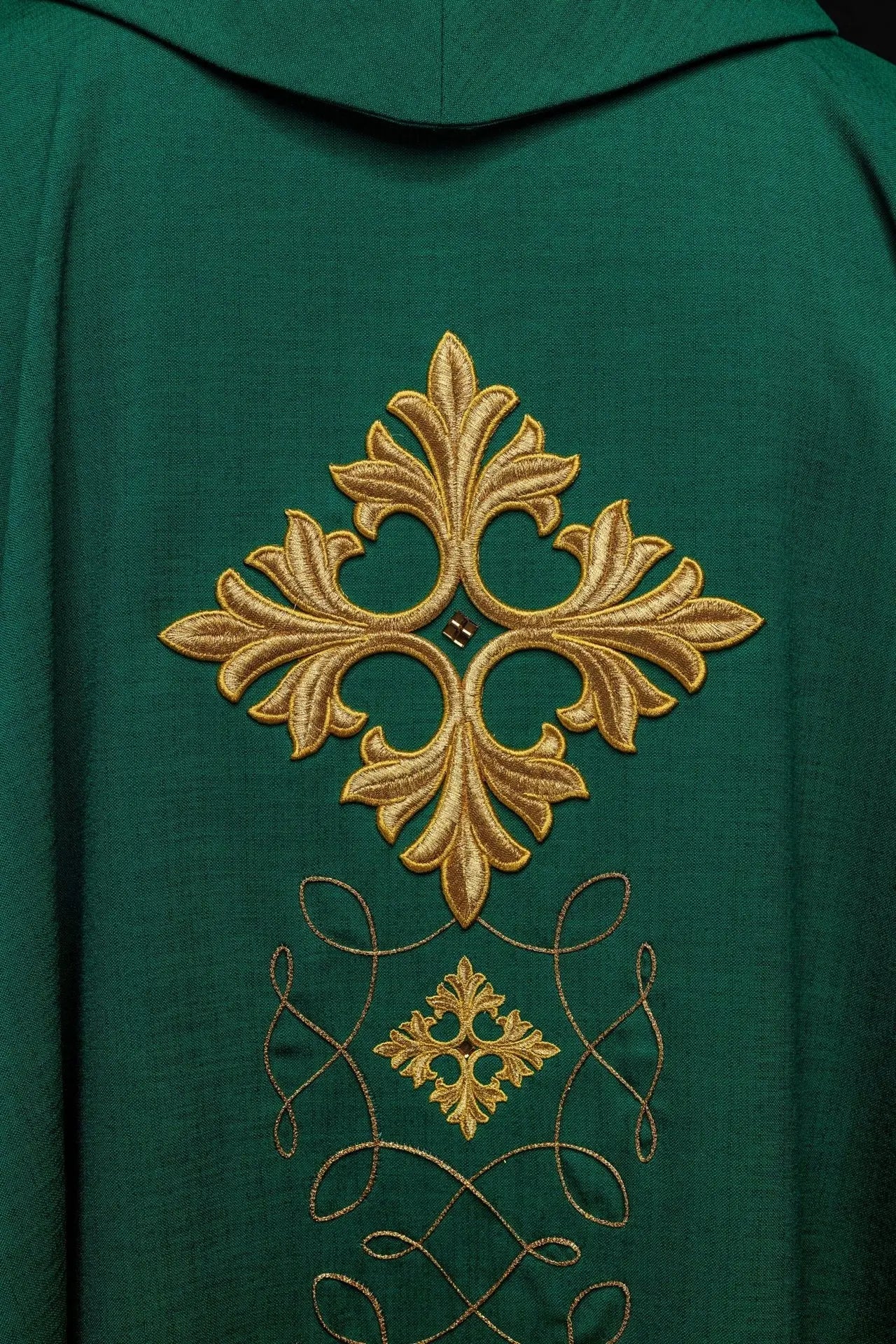 Green chasuble richly embroidered with string and stones