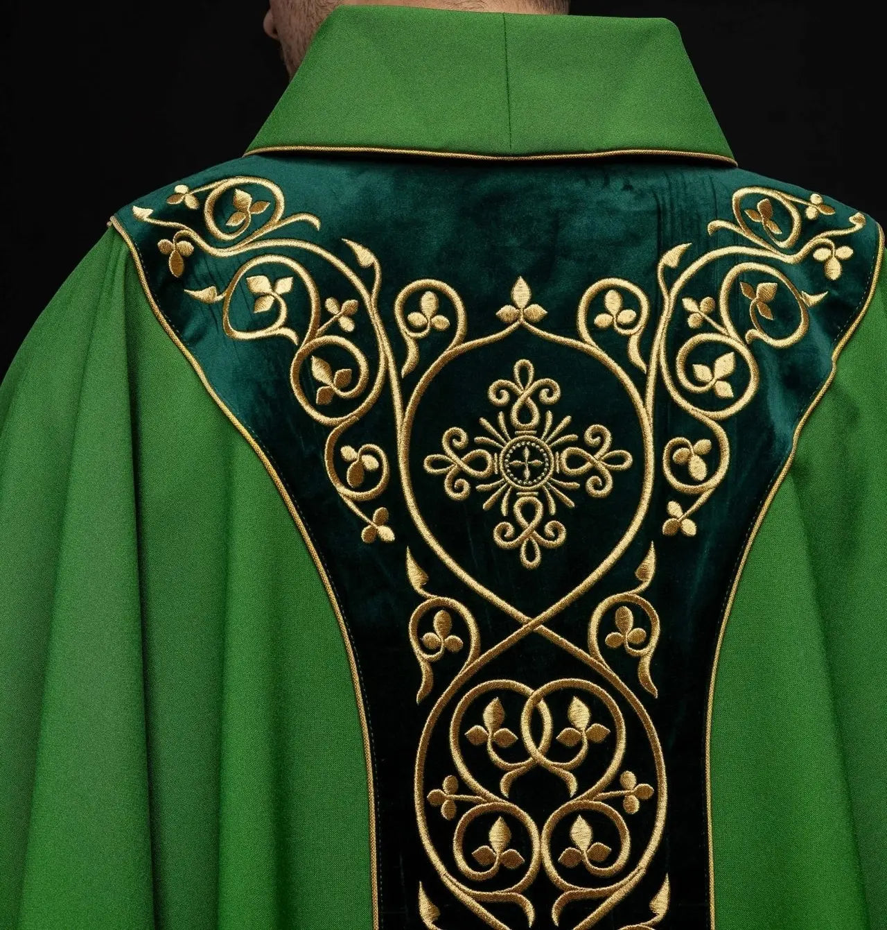 Green liturgical chasuble decorated with embroidery on velvet