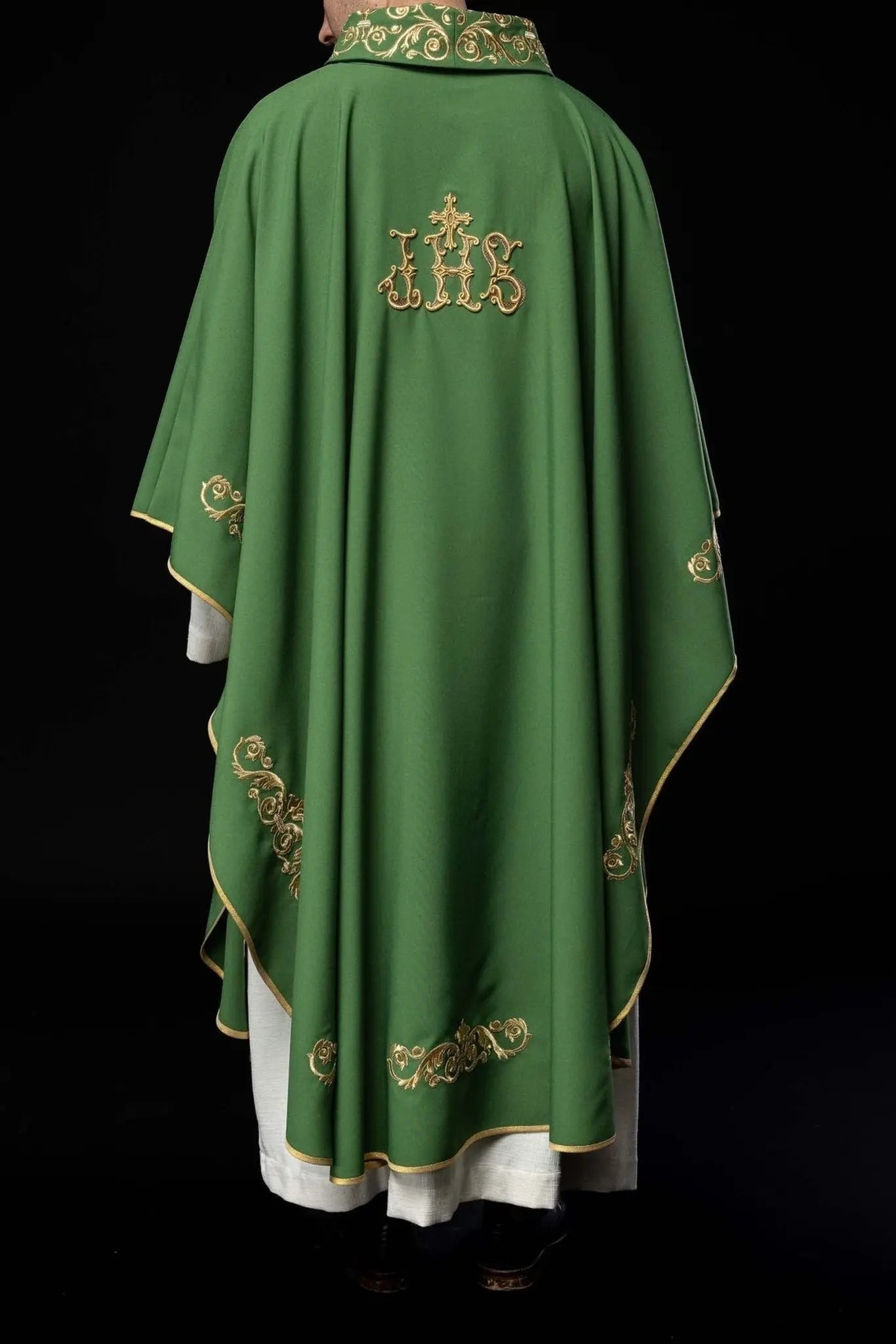 Green chasuble with gold IHS embroidery and decorative trim