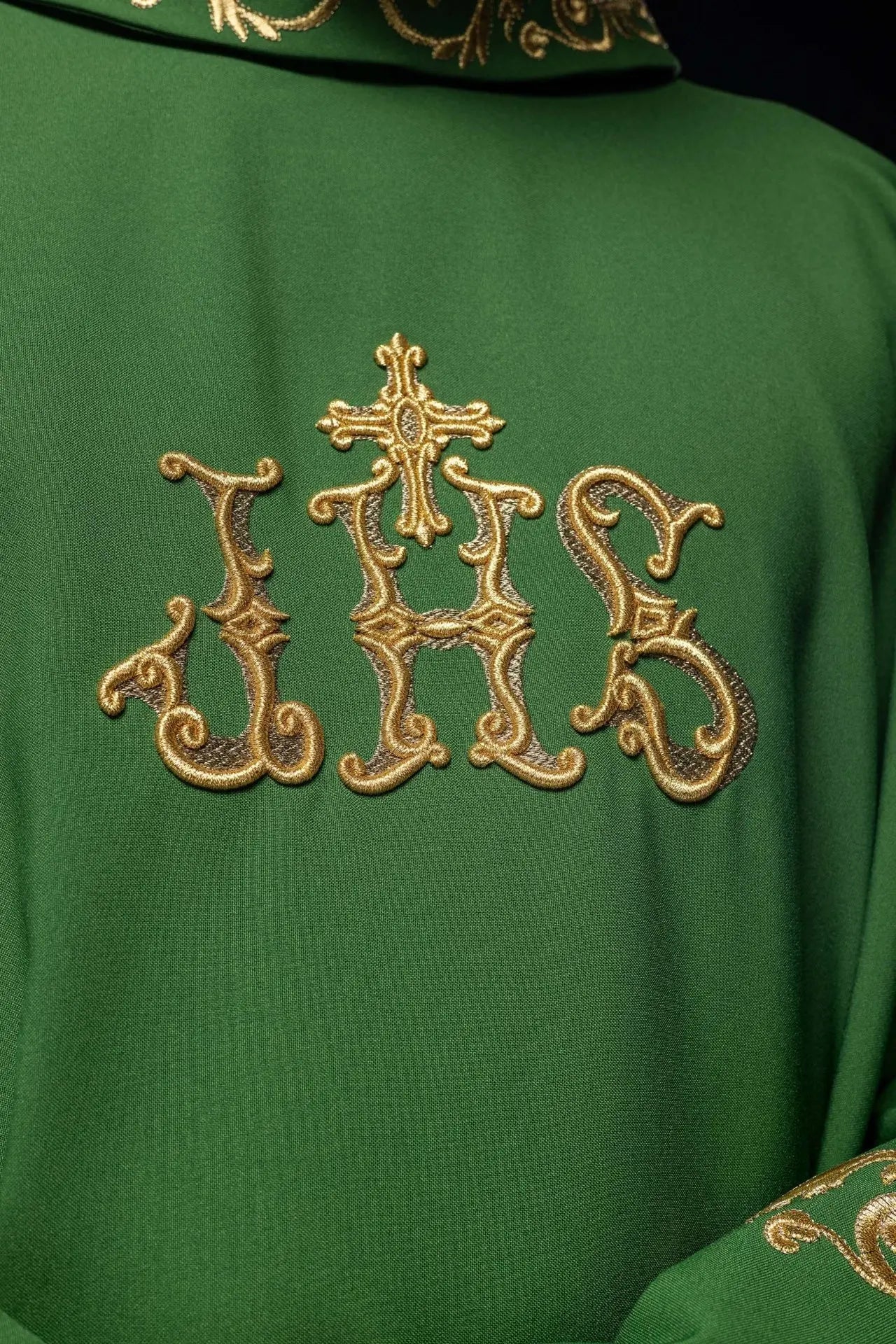 Green chasuble with gold IHS embroidery and decorative trim