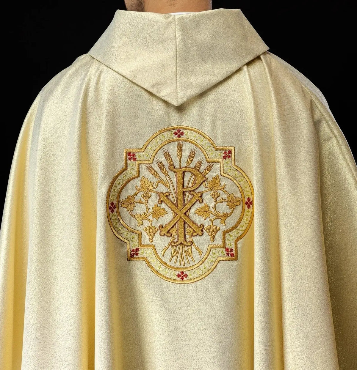 Gold chasuble with IHS and PAX embroidery