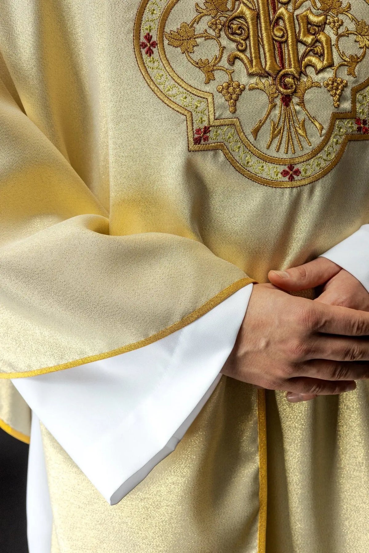 Gold chasuble with IHS and PAX embroidery