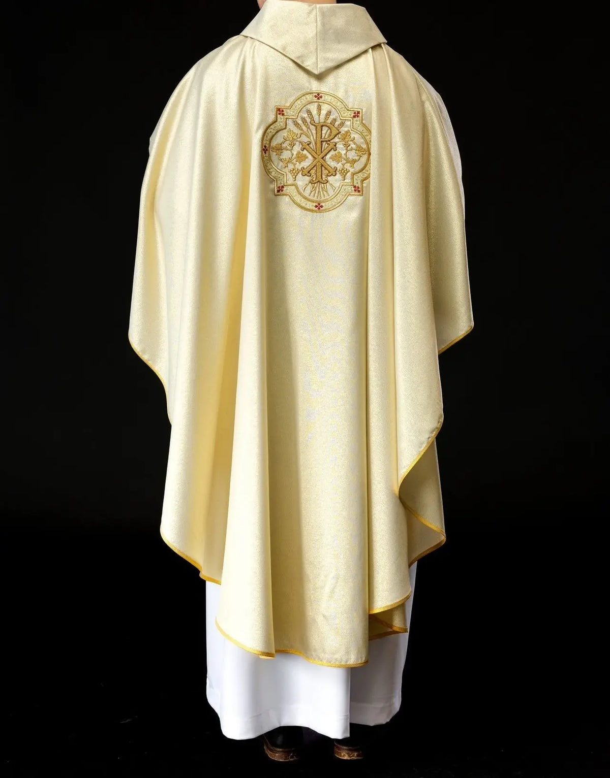 Gold chasuble with IHS and PAX embroidery
