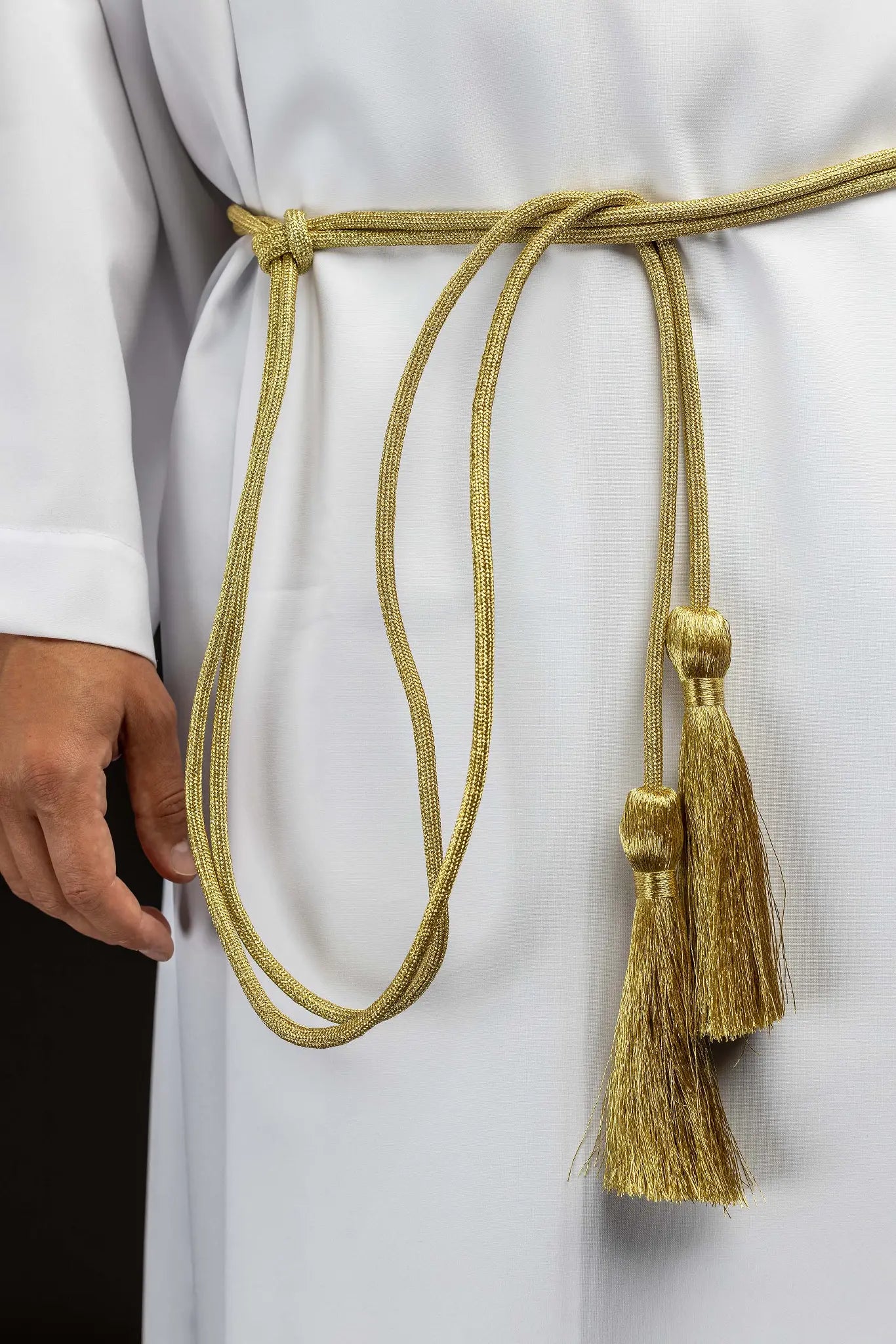 Gold liturgical cincture with decorative tassels made from braided cord