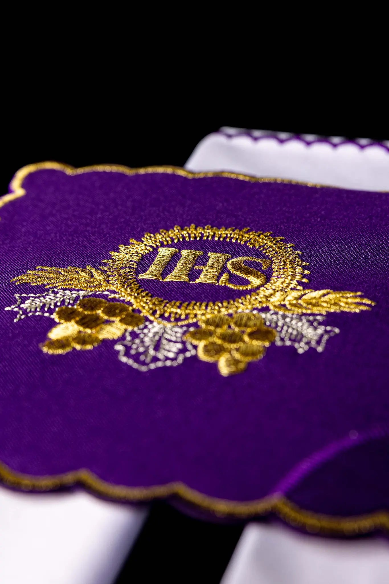 Purple chalice linen set with gold IHS embroidery on pall, corporal, purificator, and lavabo towel