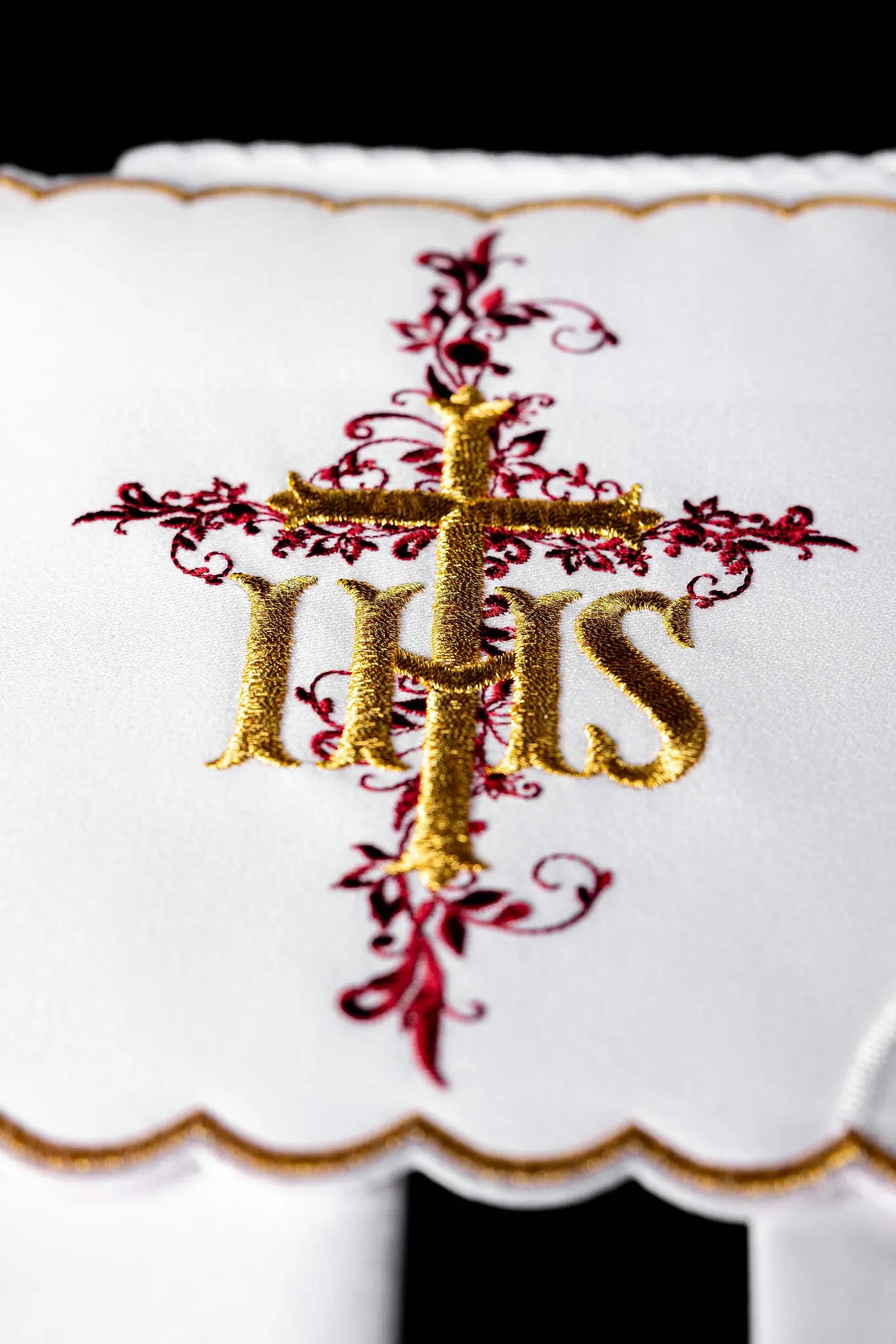 White chalice linen set with IHS embroidery, including pall, corporal, purificator, and lavabo towel.