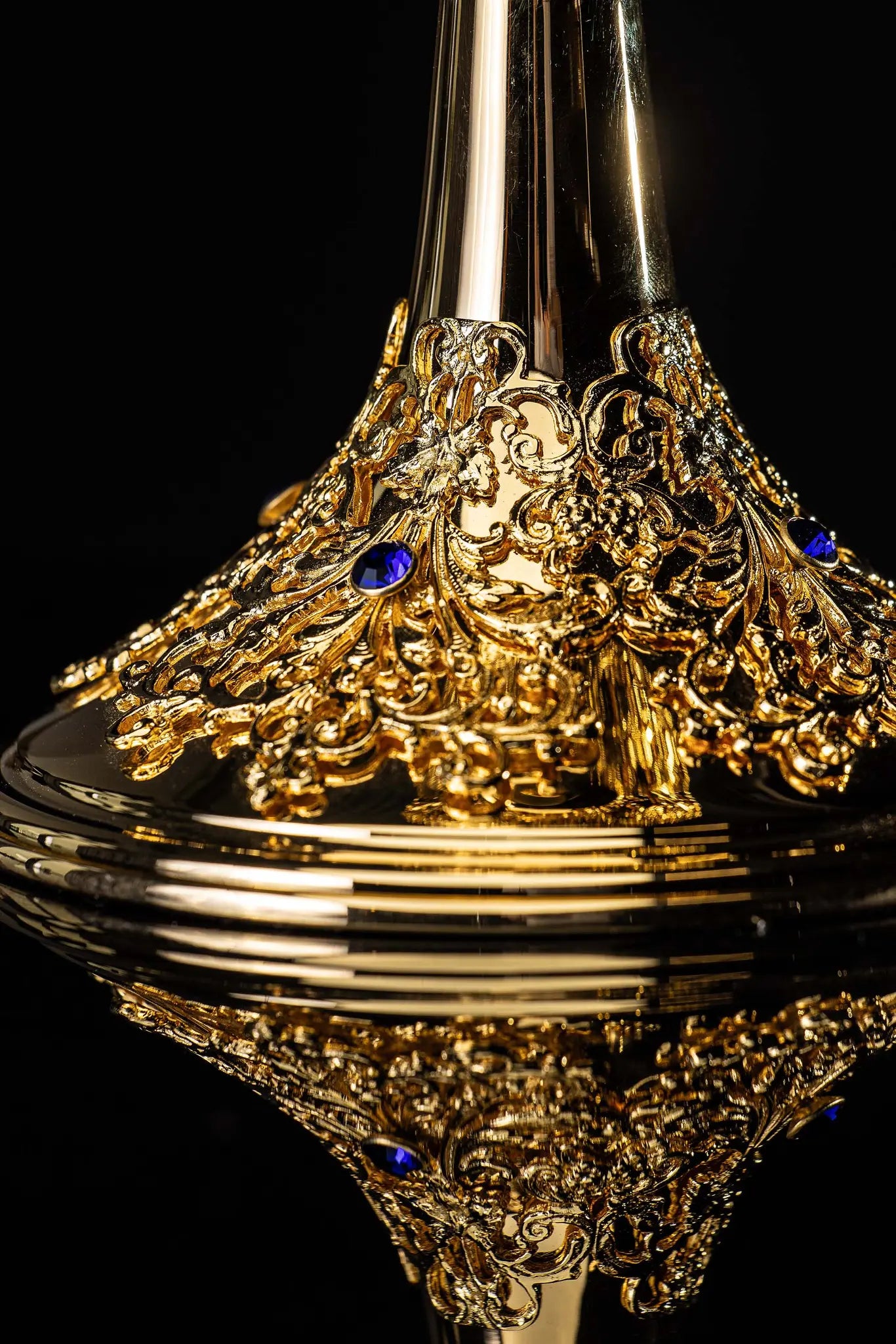 Handmade gold-plated ciborium with floral ornamentation and blue imitation sapphires, topped with a cross.