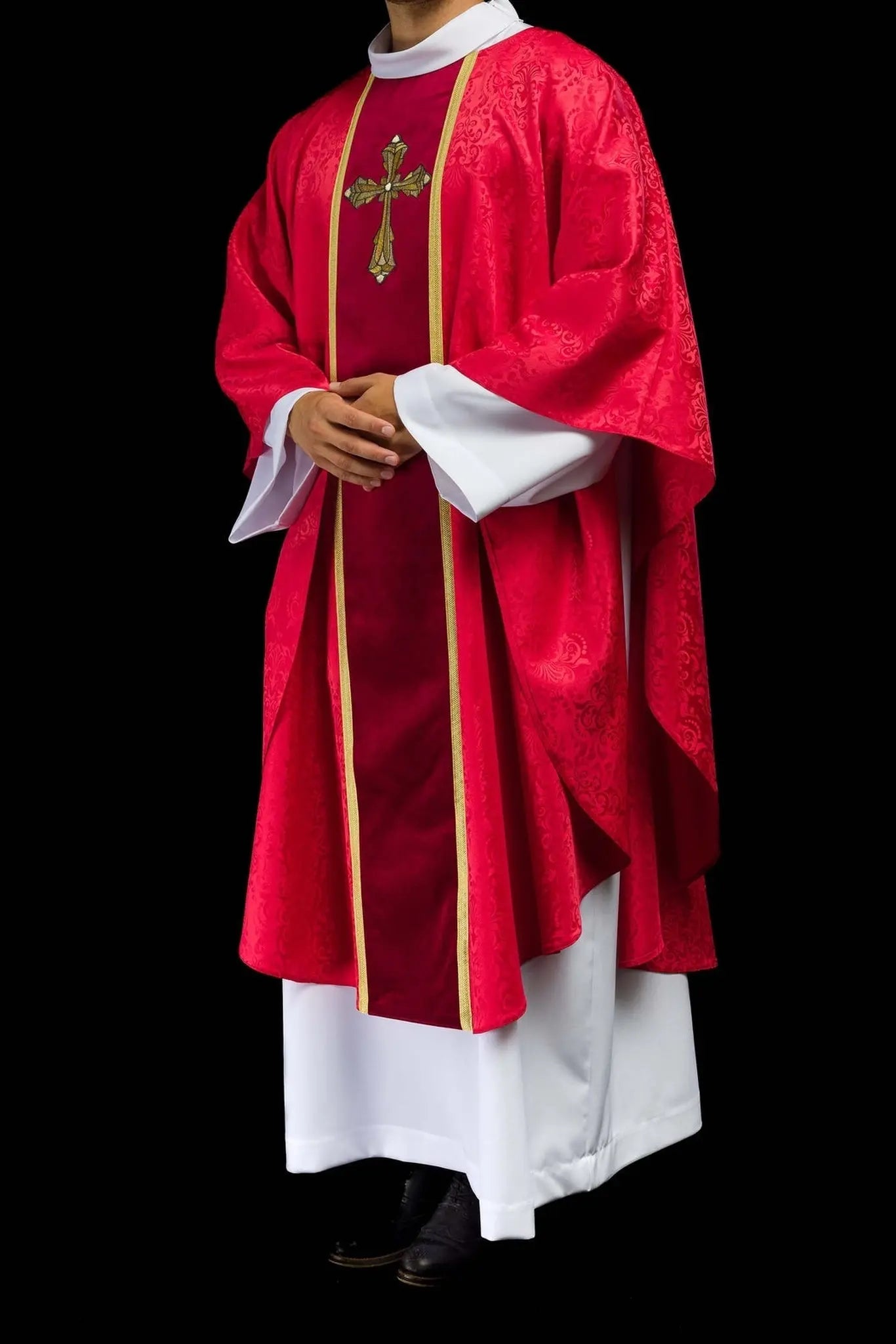 Liturgical red chasuble with band and embroidered cross on jacquard fabric