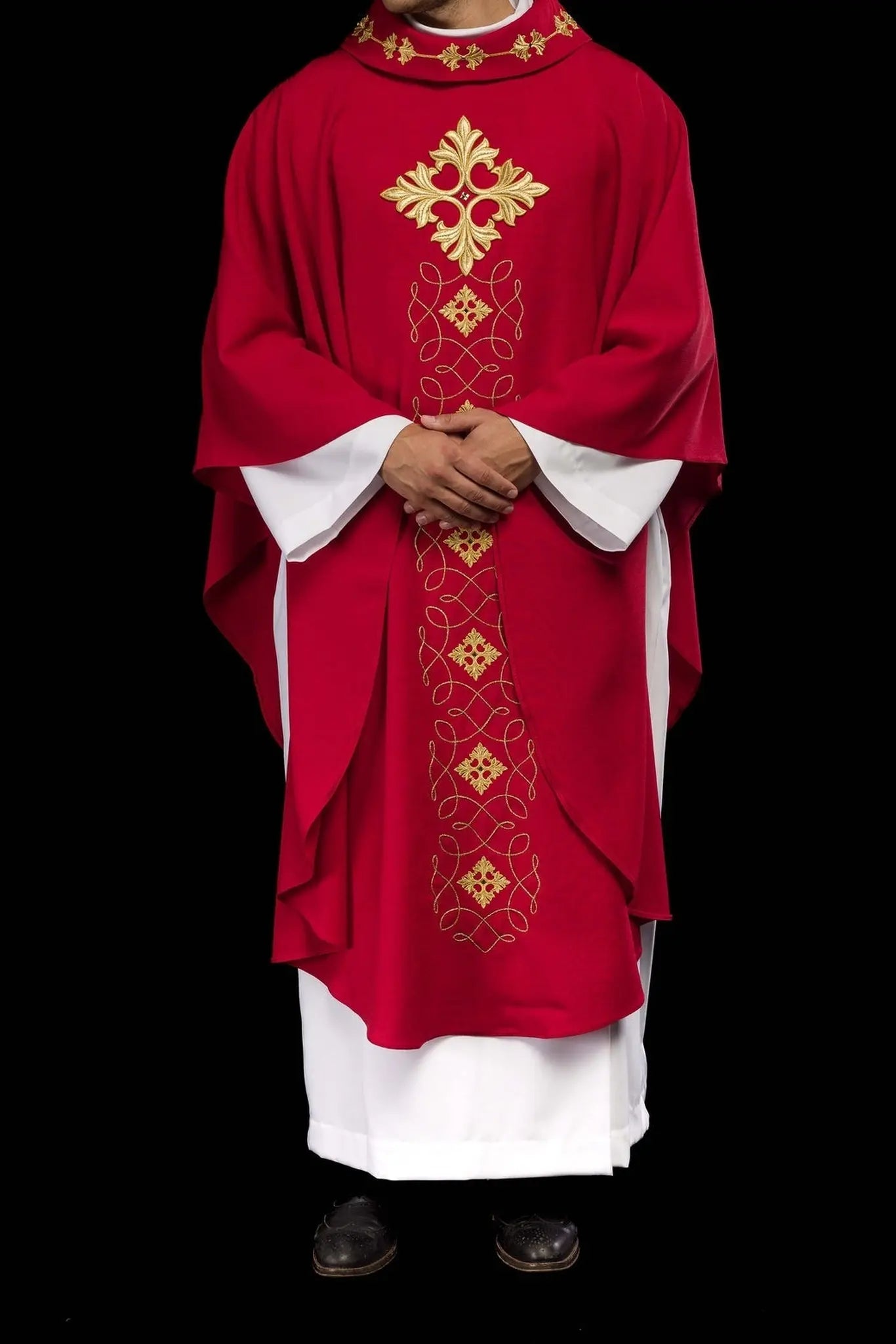Red chasuble richly embroidered with rope and stones