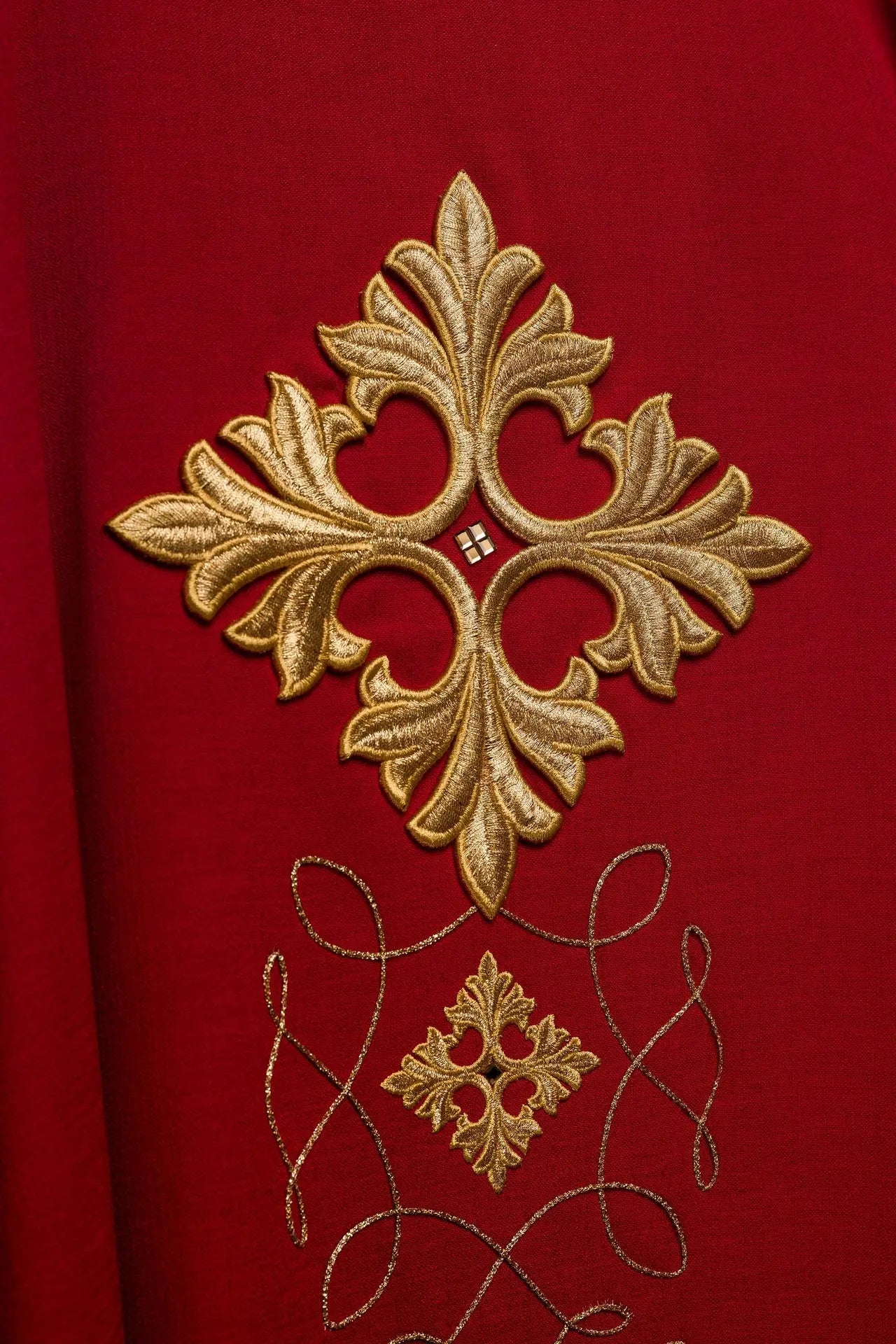 Red chasuble richly embroidered with rope and stones