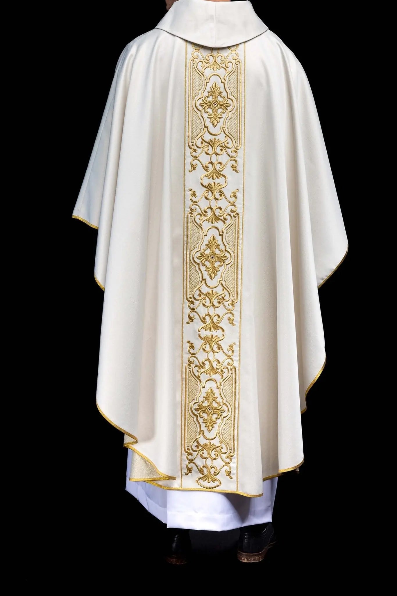 Shimmering fabric chasuble with rich gold embroidery on the belt
