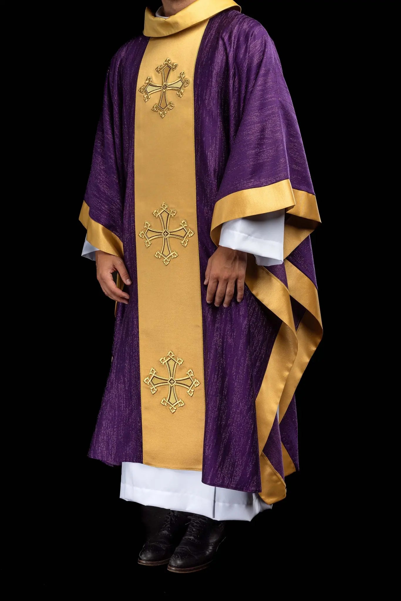 Purple chasuble with a vertical gold band featuring embroidered stylized crosses, gold trim on sleeves and collar, and a stand-up collar.