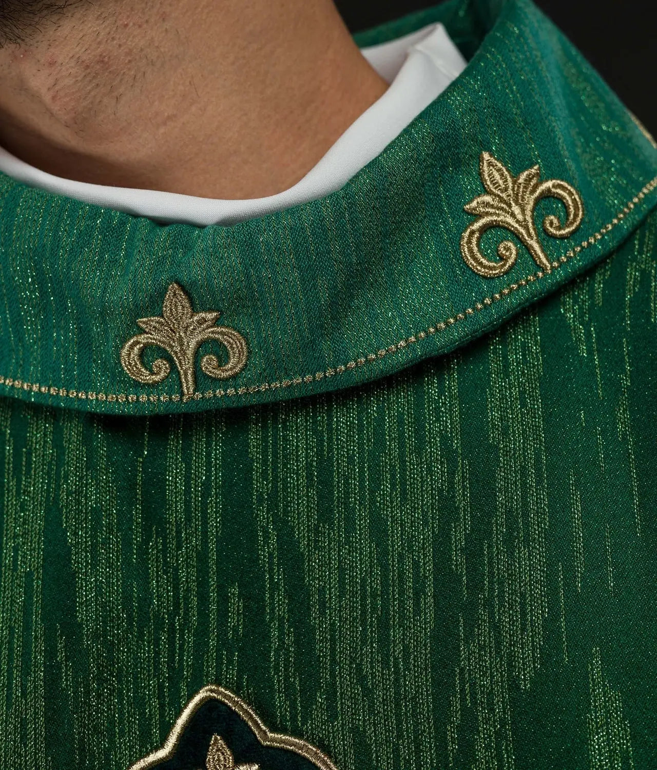 Green chasuble with richly embroidered cross and decorated collar