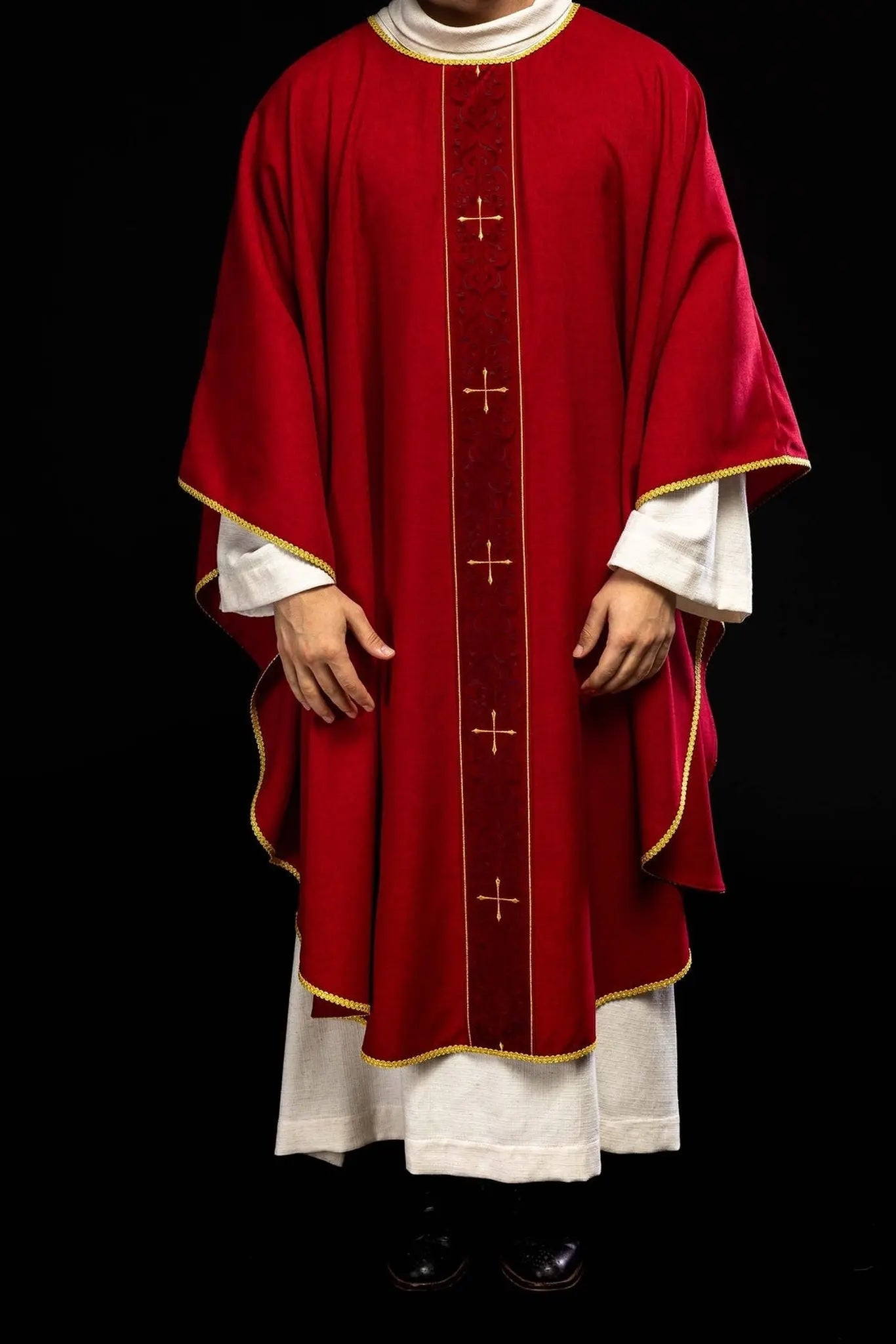 Red chasuble with an embroidered band of crosses